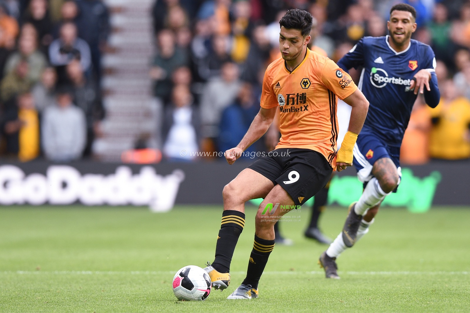 28th September 2019, Molineux, Wolverhampton, England; Premier League, Wolverhampton Wanderers v Watford : Raul Jimenez (9) of Wolverhampton Wanderers passes the ball during the game

Credit: Richard Long/News Images