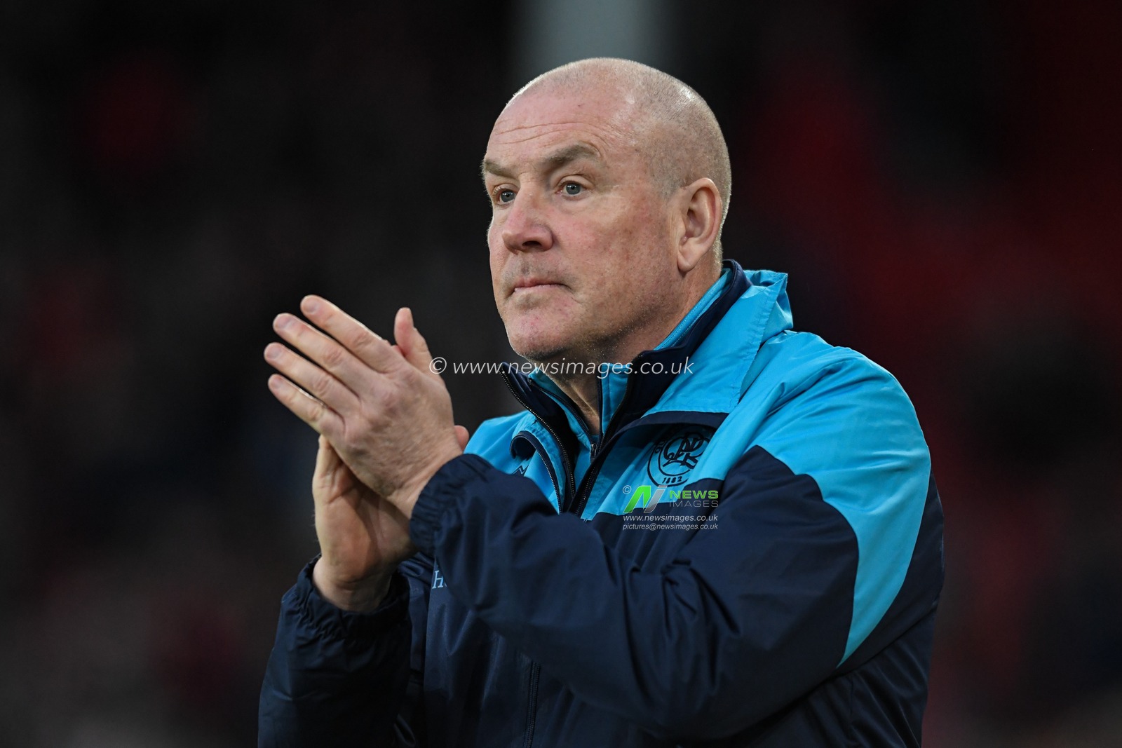 Mark Warburton manager of Queens Park Rangers applauds the travelling supporters