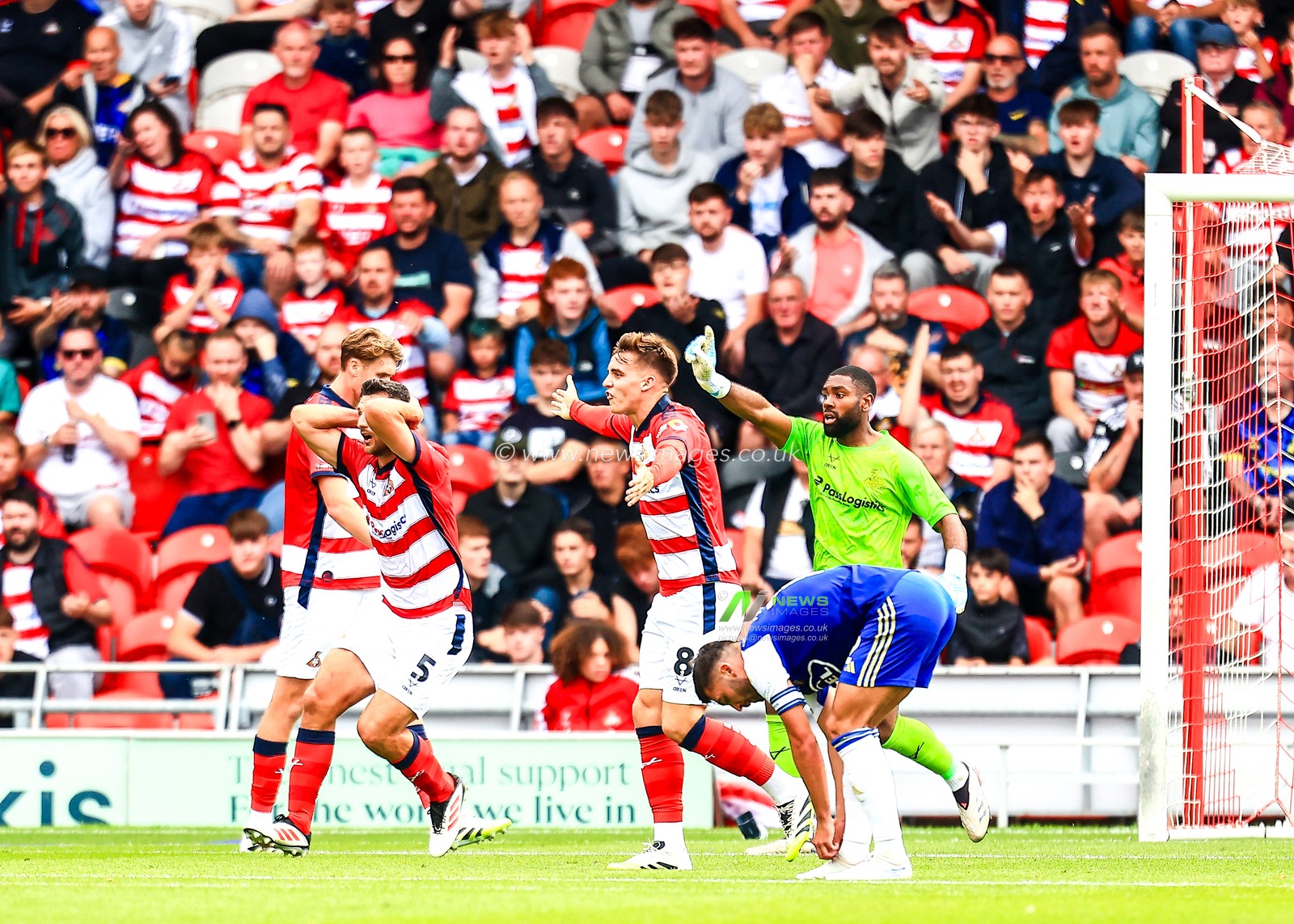 Matty Pearson of Doncaster Rovers reacts during the Sky Bet League 1 match Doncaster Rovers vs Exeter City at Eco-Power Stadium, Doncaster, United Kingdom, 2nd August 2025

(Photo by Richard Bierton/News Images)