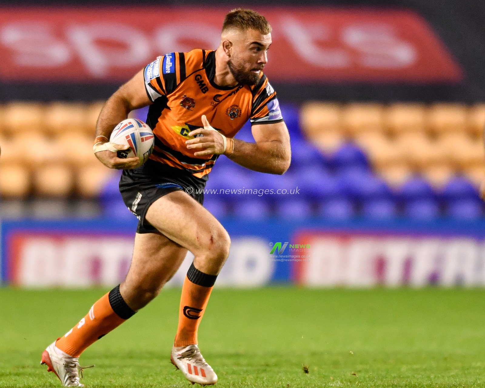 Mike McMeeken (12) of Castleford Tigers runs forward with the ball