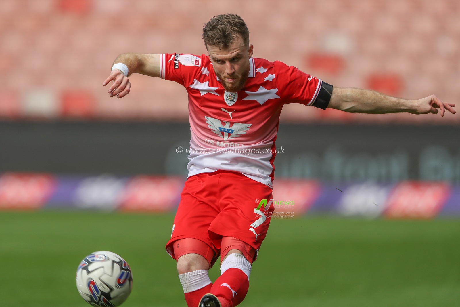 Nicky Cadden of Barnsley crosses the ball during the Sky Bet League 1 match Barnsley vs Reading at Oakwell, Barnsley, United Kingdom, 13th April 2024

(Photo by Alfie Cosgrove/News Images)