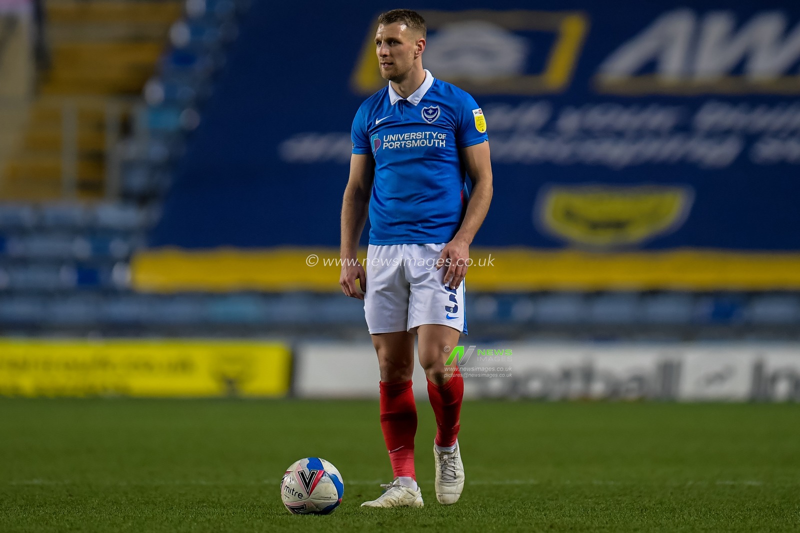 Lee Brown #3 of Portsmouth stands over the ball