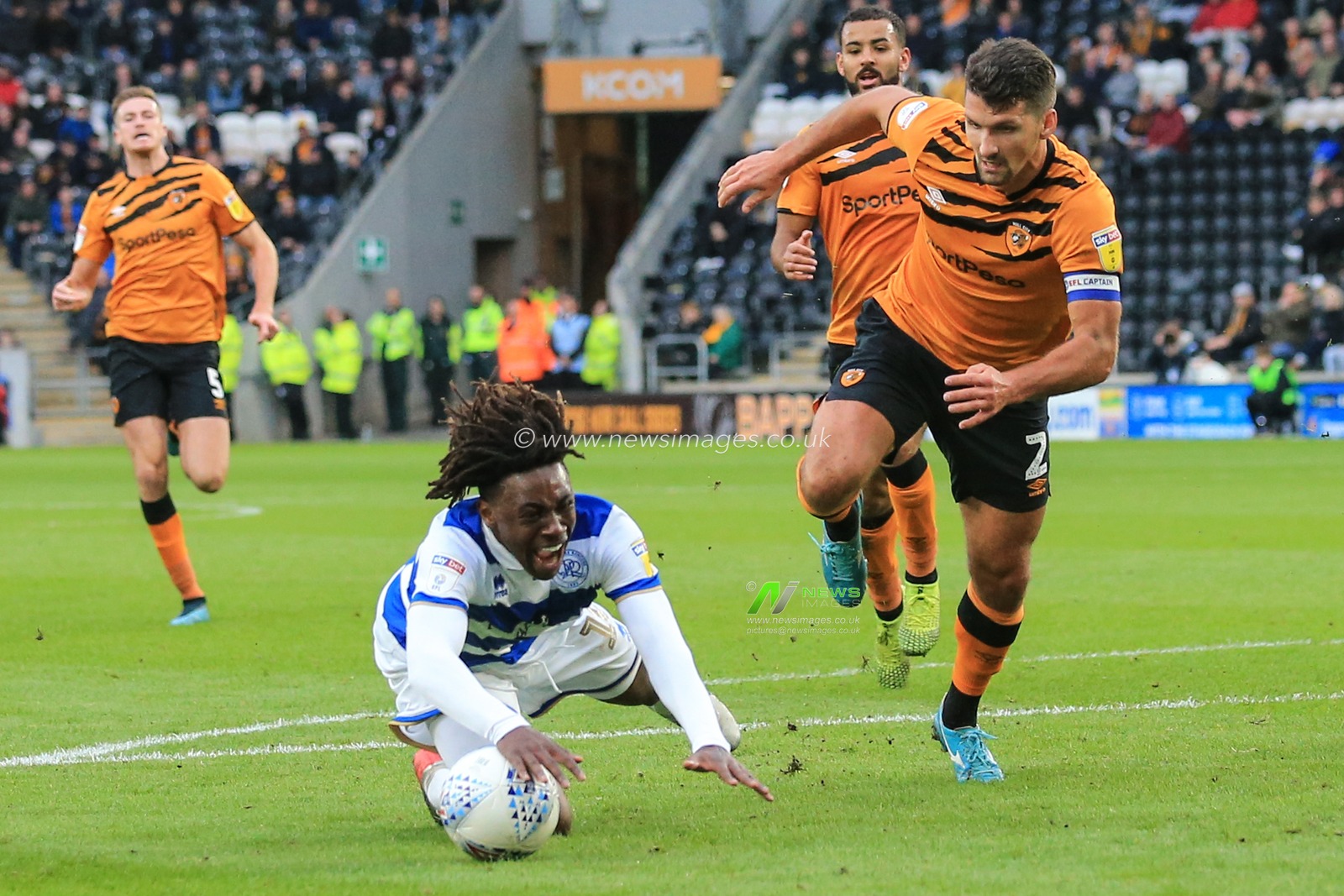 19th October 2019, KC Stadium, Kingston upon Hull, England; Sky Bet Championship, Hull City v Queens Park Rangers : Eberechi Eze (10) of QPR goes down in the penalty area after being fouled by Eric Lichaj (2) of Hull City 

Credit: David Greaves/News Images