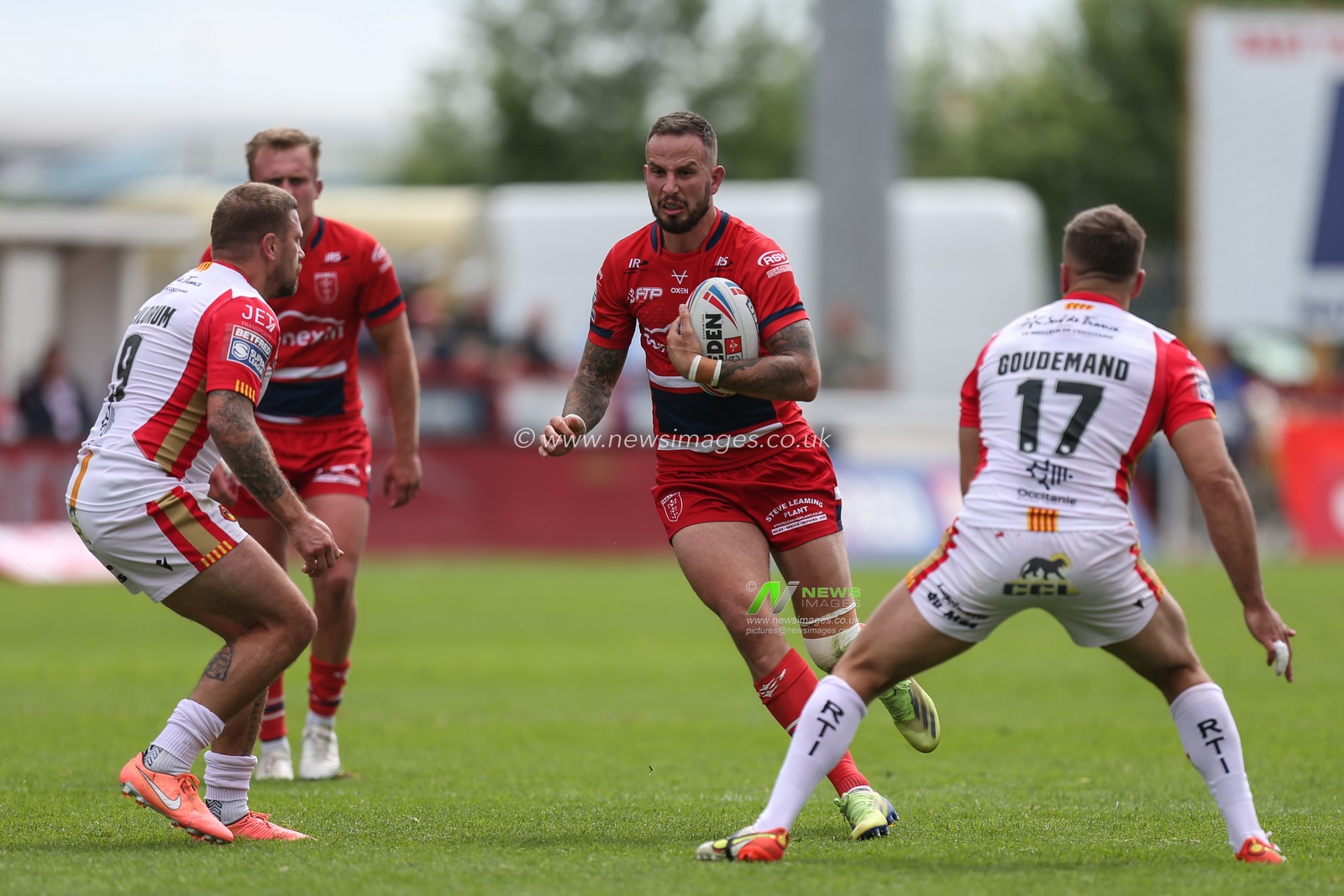 Ben Crooks #2 of Hull KR runs at the Catalans defence