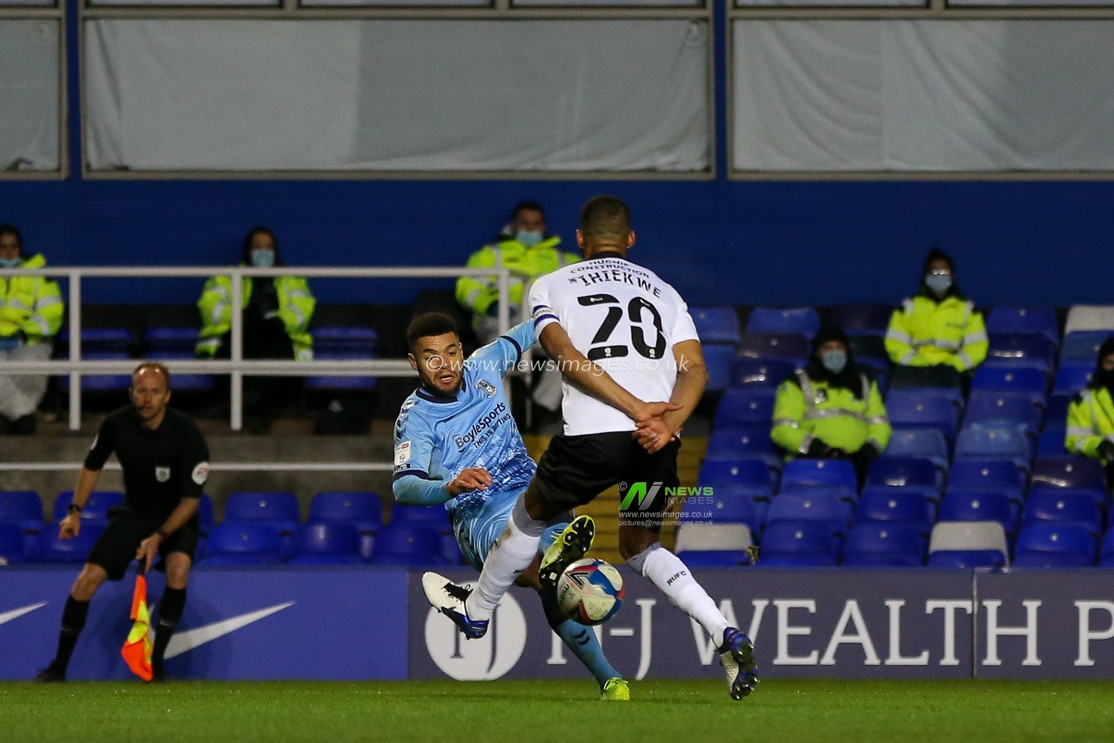Maxime Biamou #9 of Coventry City crosses the ball through the legs of Michael Ihiekwe #20 of Rotherham United