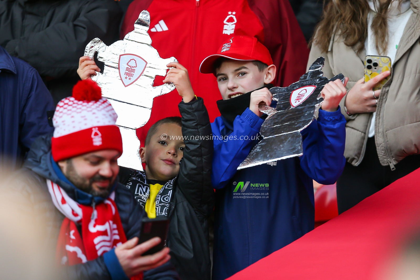 A Young fan holds up an FA Cup made from tin foil during the Emirates FA Cup Third Round match Nottingham Forest vs Blackpool at City Ground, Nottingham, United Kingdom, 7th January 2024

(Photo by Gareth Evans/News Images)