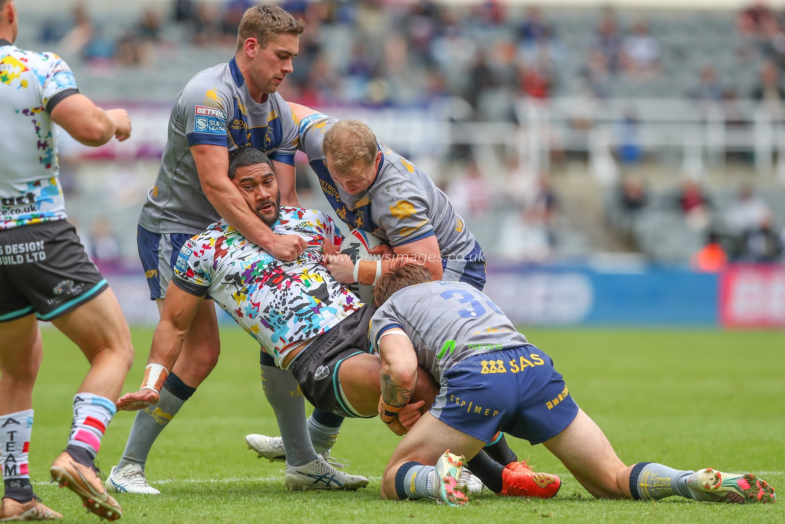Ricky Leutele #4 of Leigh Leopards is tackled during the Magic Weekend match Wakefield Trinity vs Leigh Leopards at St. James's Park, Newcastle, United Kingdom, 4th June 2023

(Photo by Gareth Evans/News Images)