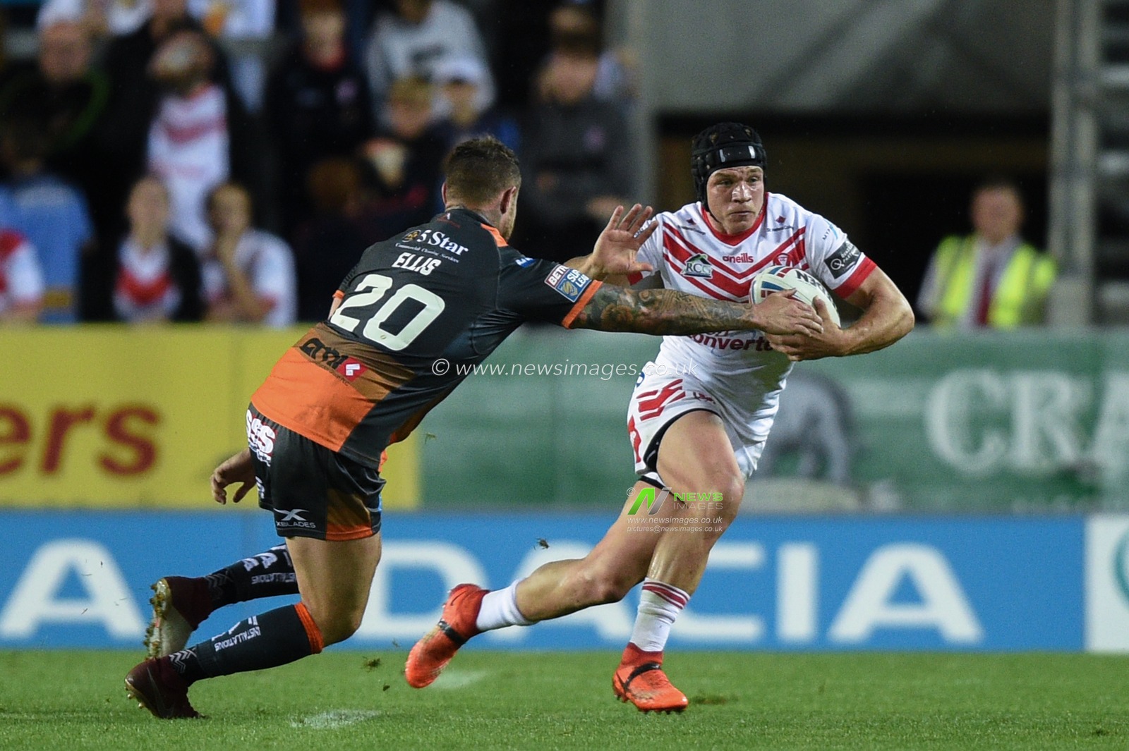 30th August 2019 , Totally Wicked Stadium, St Helens, England;  Betfred Super League Rugby, Round 27, St Helens vs Castleford Tigers ; Jonny Lomax (1) of St Helens is tackled by Jamie Ellis (20) of Castleford Tigers 

Credit: Richard Long/News Images