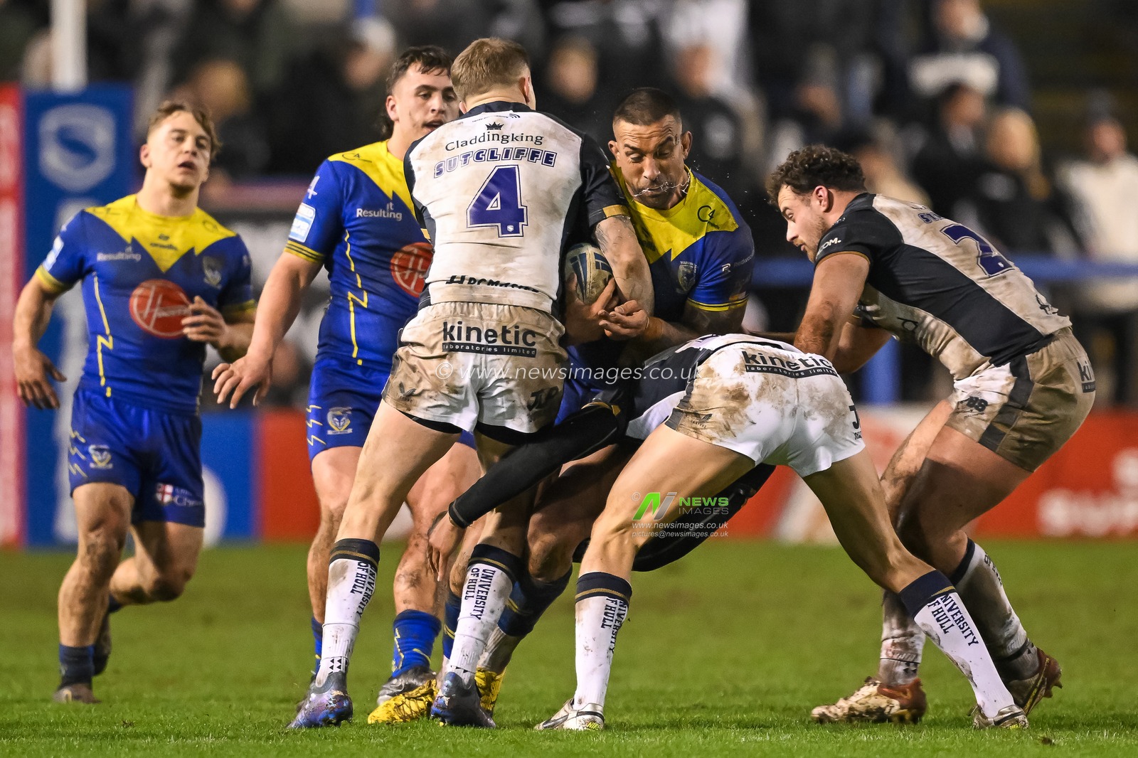 Paul Vaughan of Warrington Wolves is tackled by Charlie Severs Hull FC and Liam Sutcliffe Hull FC during the Betfred Super League Round 2 match Warrington Wolves vs Hull FC at Halliwell Jones Stadium, Warrington, United Kingdom, 23rd February 2024

(Photo by Craig Thomas/News Images)