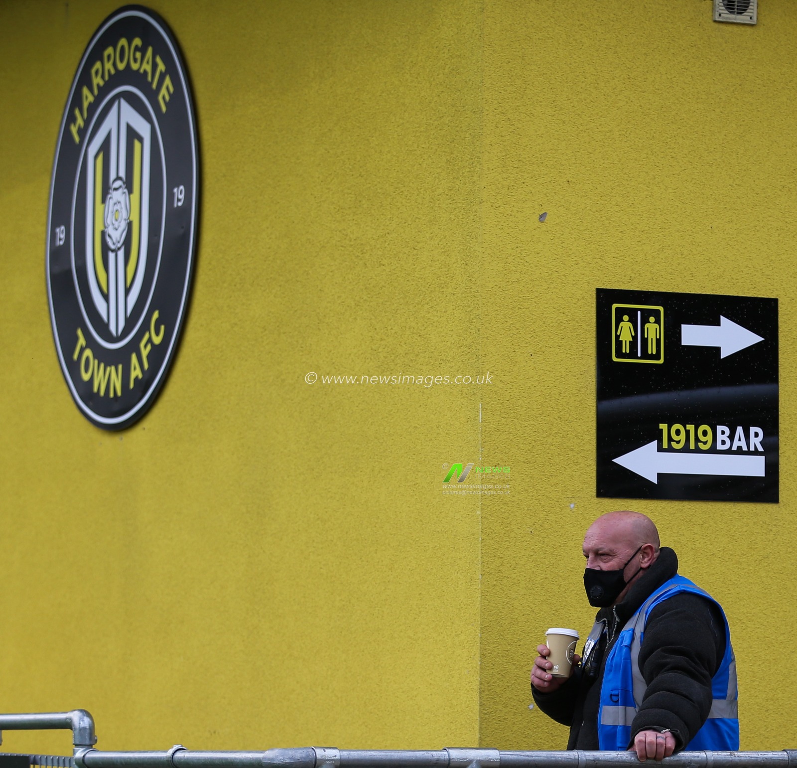 A steward is seen during the game