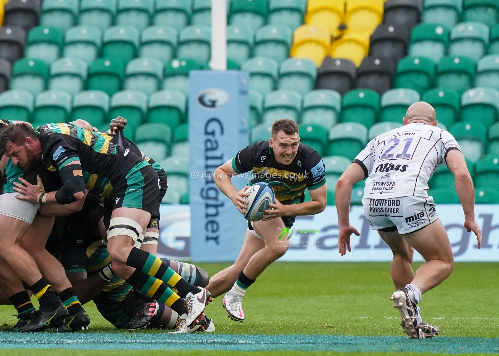 Tom James #9 of Northampton Saints has the ball from the scrum