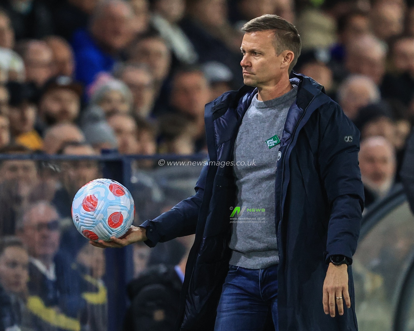 Jesse Marsch manager of Leeds United removes the match ball from play due to lack of pressure in the ball