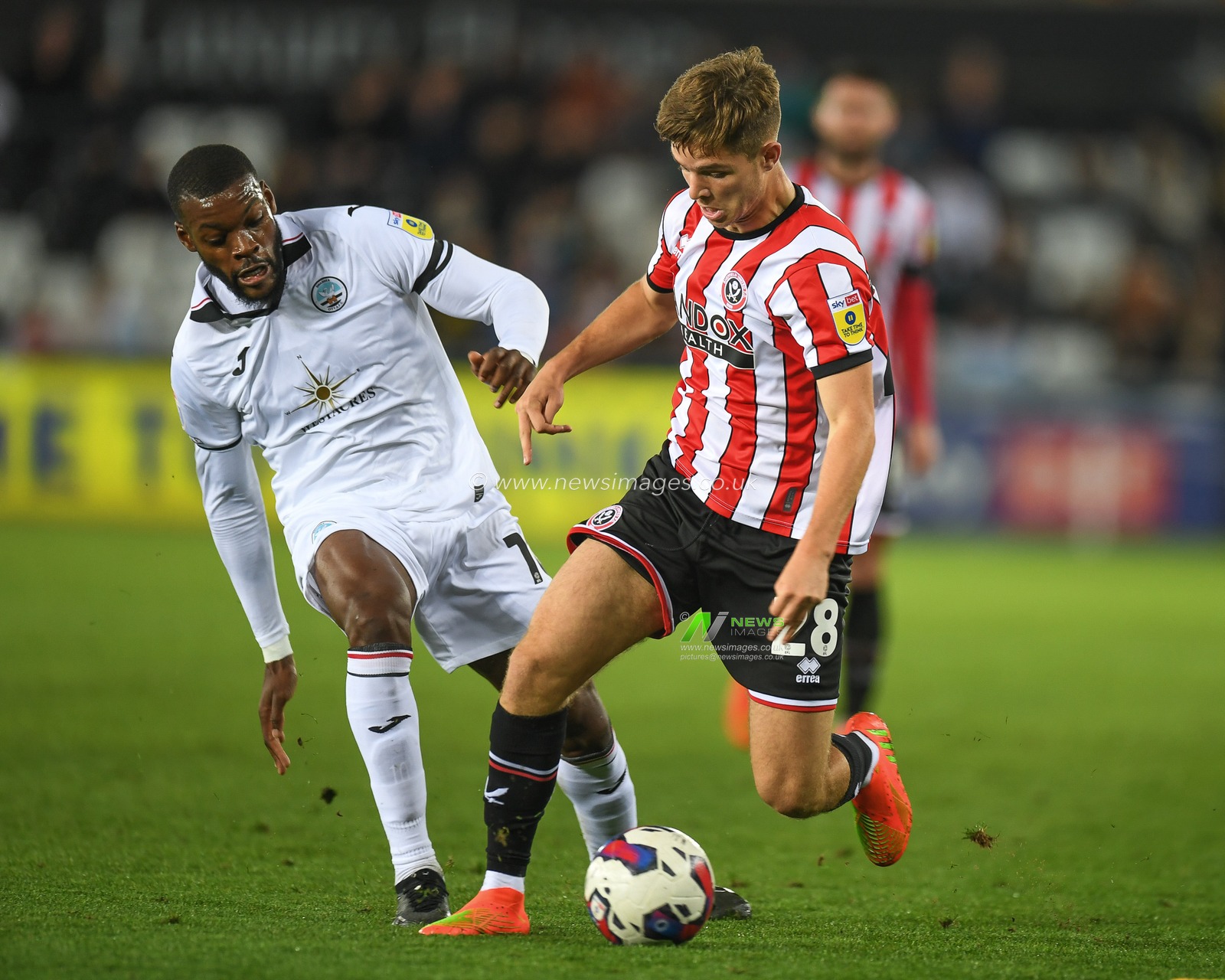 James McAtee #28 of Sheffield United Under pressure from Olivier Ntcham #10 of Swansea City during the Sky Bet Championship match Swansea City vs Sheffield United at Swansea.com Stadium, Swansea, United Kingdom, 13th September 2022

(Photo by Mike Jones/News Images)