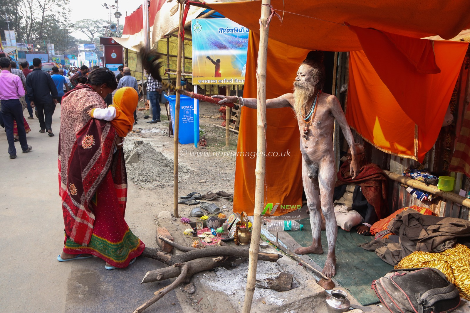 A Naga saint is giving his blessings to pilgrims at a transit camp of the Gangasagar fair in Kolkata, India, on January 9, 2025. The Gangasagar Mela is an annual Hindu festival held at Gangasagar, West Bengal, where the Ganges River meets the Bay of Bengal. The fair takes place at Kapilmuni's ashram on Gangasagar every year on Makar Sankranti.Pictures by Debajyoti Chakraborty.(Photo: Debajyoti Chakraborty/News Images)