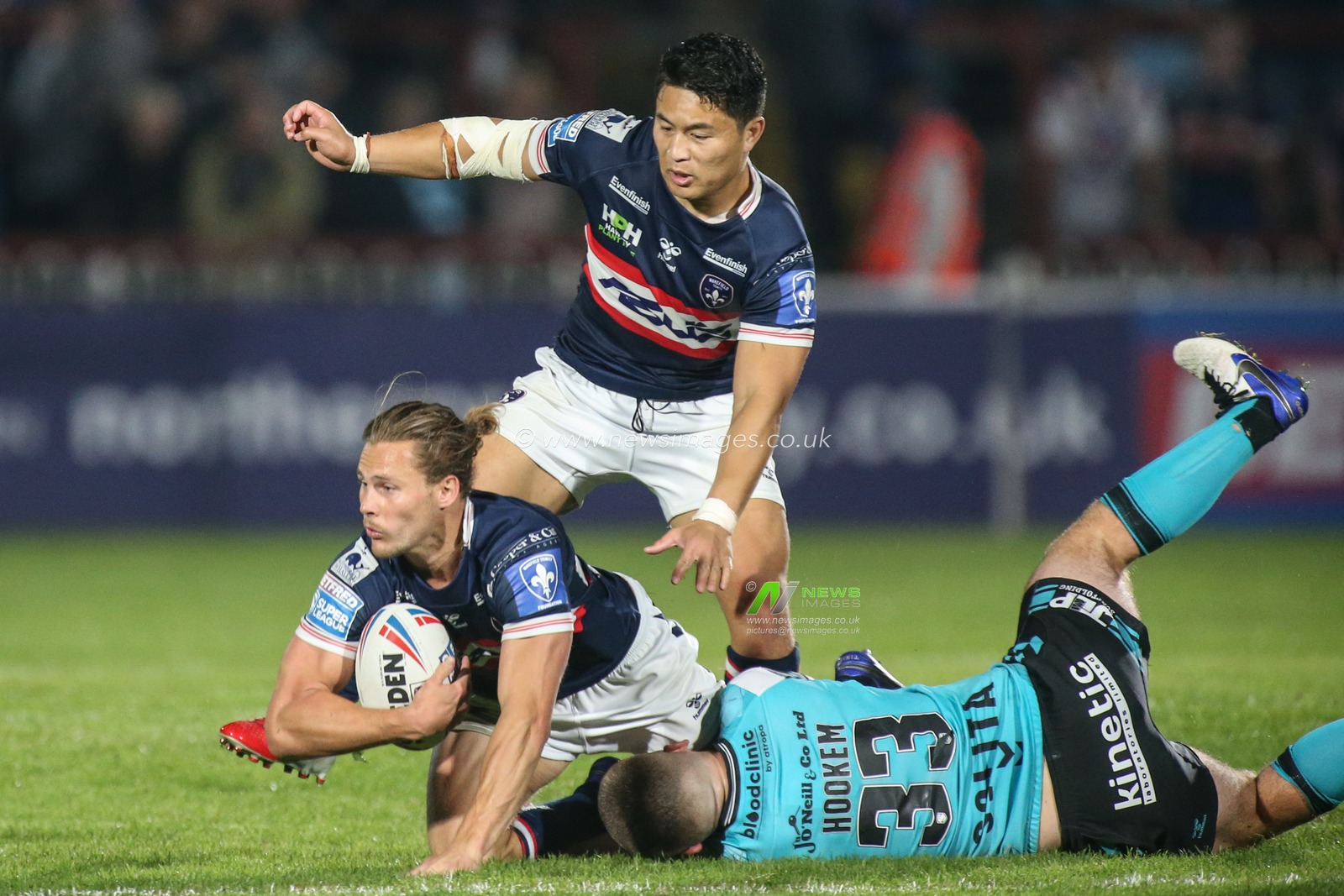 Jacob Miller (6) of Wakefield Trinity looks to pass the ball
