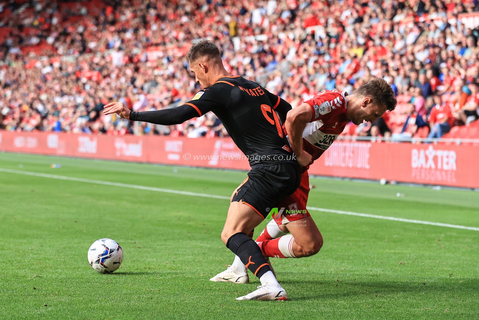 Jerry Yates #9 of Blackpool holds the ball