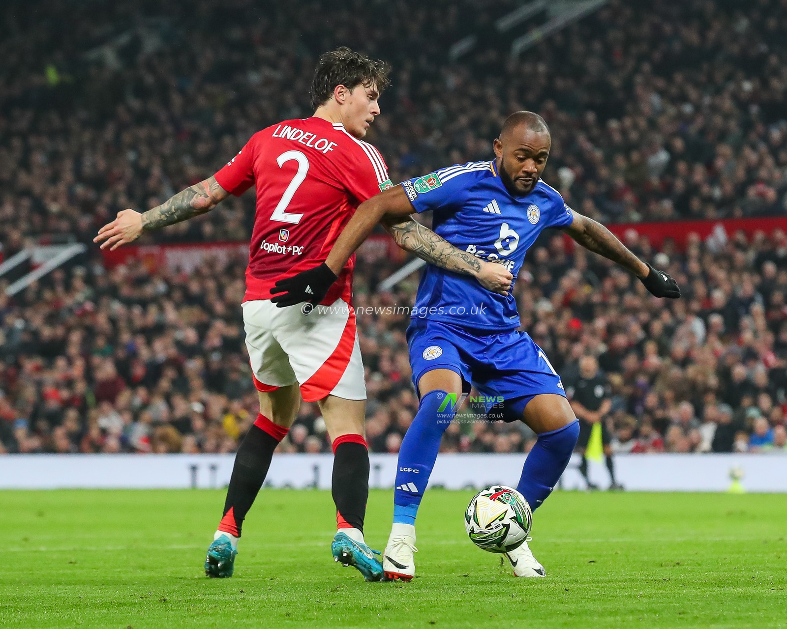 Jordan Ayew of Leicester City and Victor LindelÃ¶f of Manchester United battles for the ball during the Carabao Cup Last 16 match Manchester United vs Leicester City at Old Trafford, Manchester, United Kingdom, 30th October 2024

(Photo by Gareth Evans/News Images)