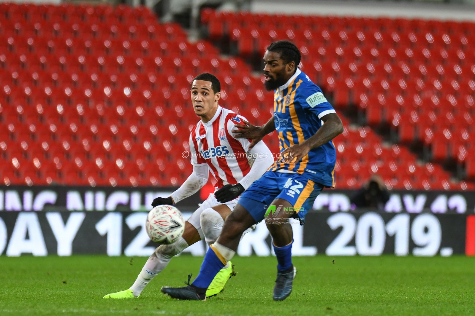 15th January 2019, Bet 365 Stadium, Stoke-on-Trent, England; Emirates FA Cup, 3rd Round replay, Stoke City vs Shrewsbury Town ; Anthony Grant (42) of Shrewsbury Town challenges Thomas Ince (7) of Stoke City 


Credit: Richard Long/News Images

English Football League images are subject to DataCo Licence
