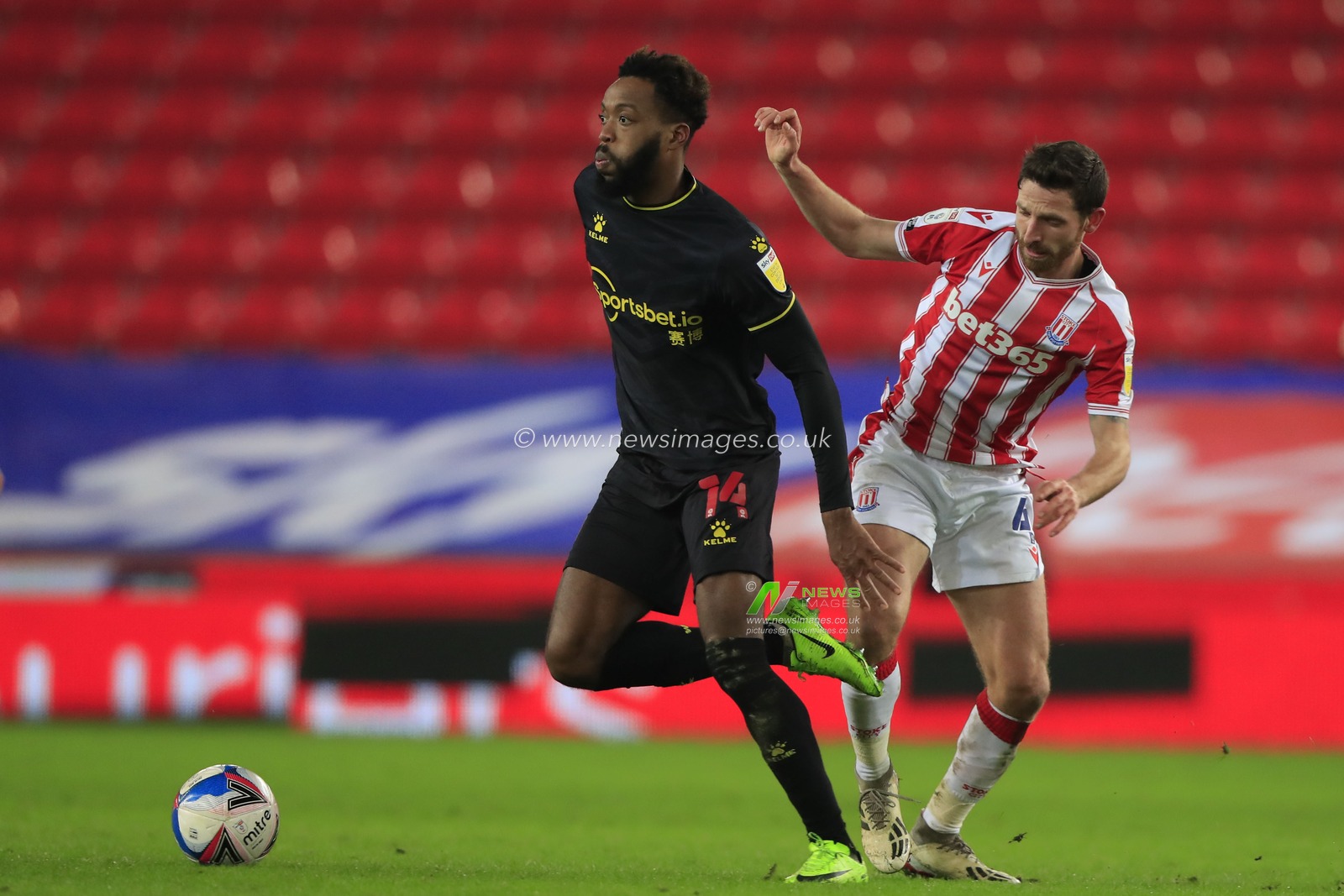 Nathaniel Chalobah #14 of Watford escapes from Joe Allen #4 of Stoke City