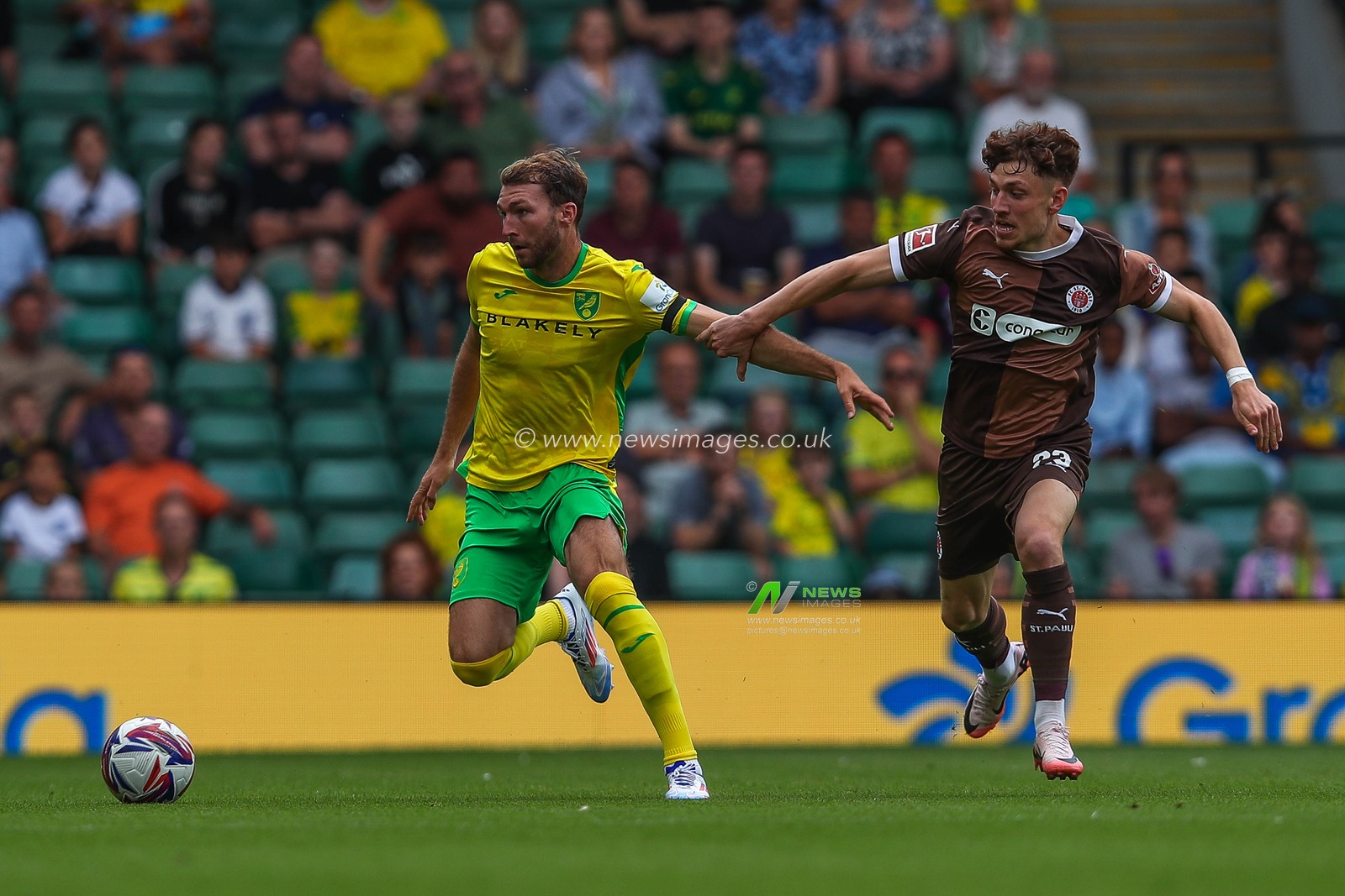 Jack Stacey of Norwich City battles for the ball with Philipp Treu of St Pauli during the Pre-season friendly match Norwich City vs St. Pauli at Carrow Road, Norwich, United Kingdom, 3rd August 2024

(Photo by Izzy Poles/News Images)