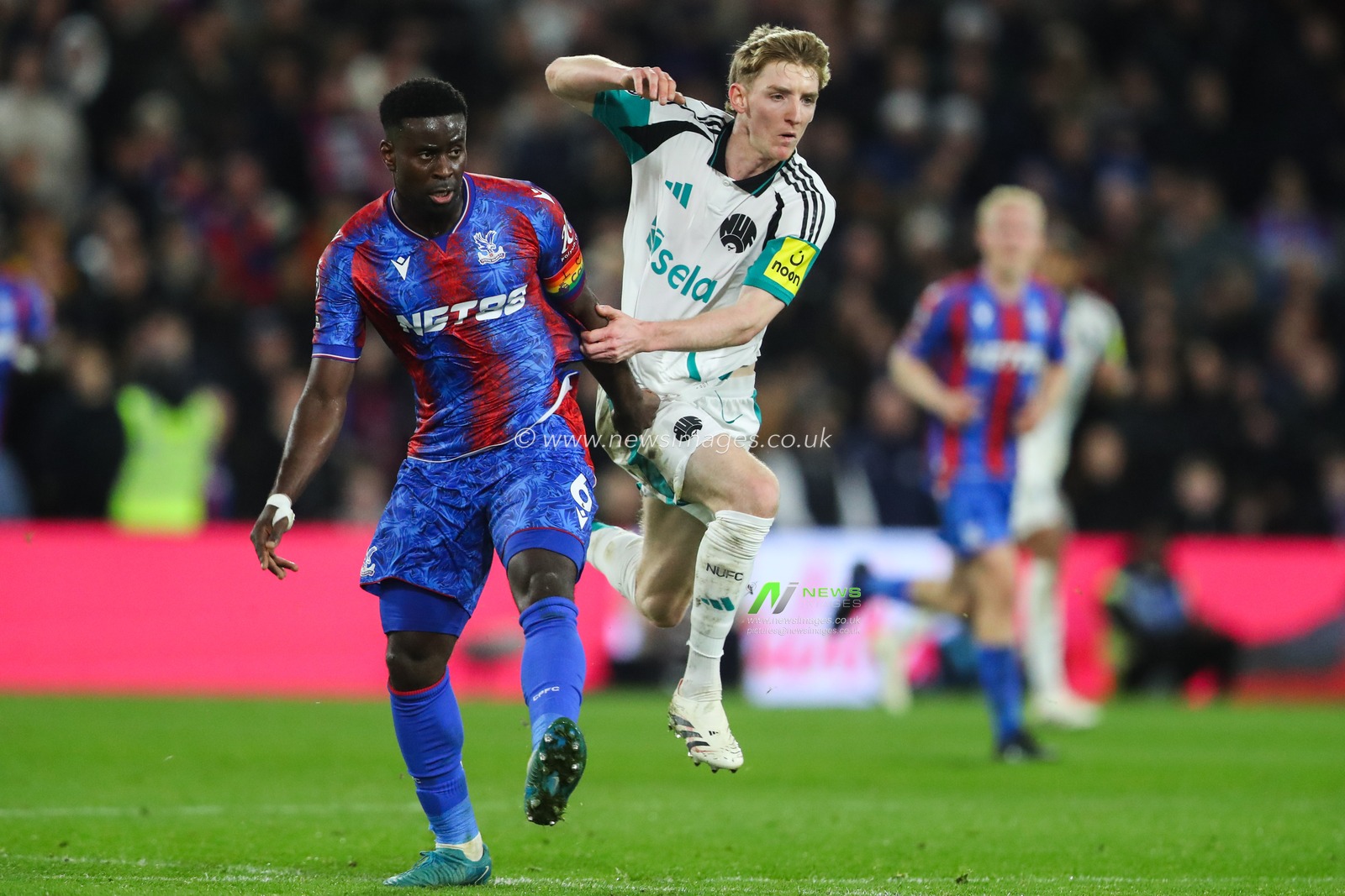 Marc GuÃ©hi of Crystal Palace and Anthony Gordon of Newcastle United battle during the Premier League match Crystal Palace vs Newcastle United at Selhurst Park, London, United Kingdom, 30th November 2024

(Photo by Gareth Evans/News Images)