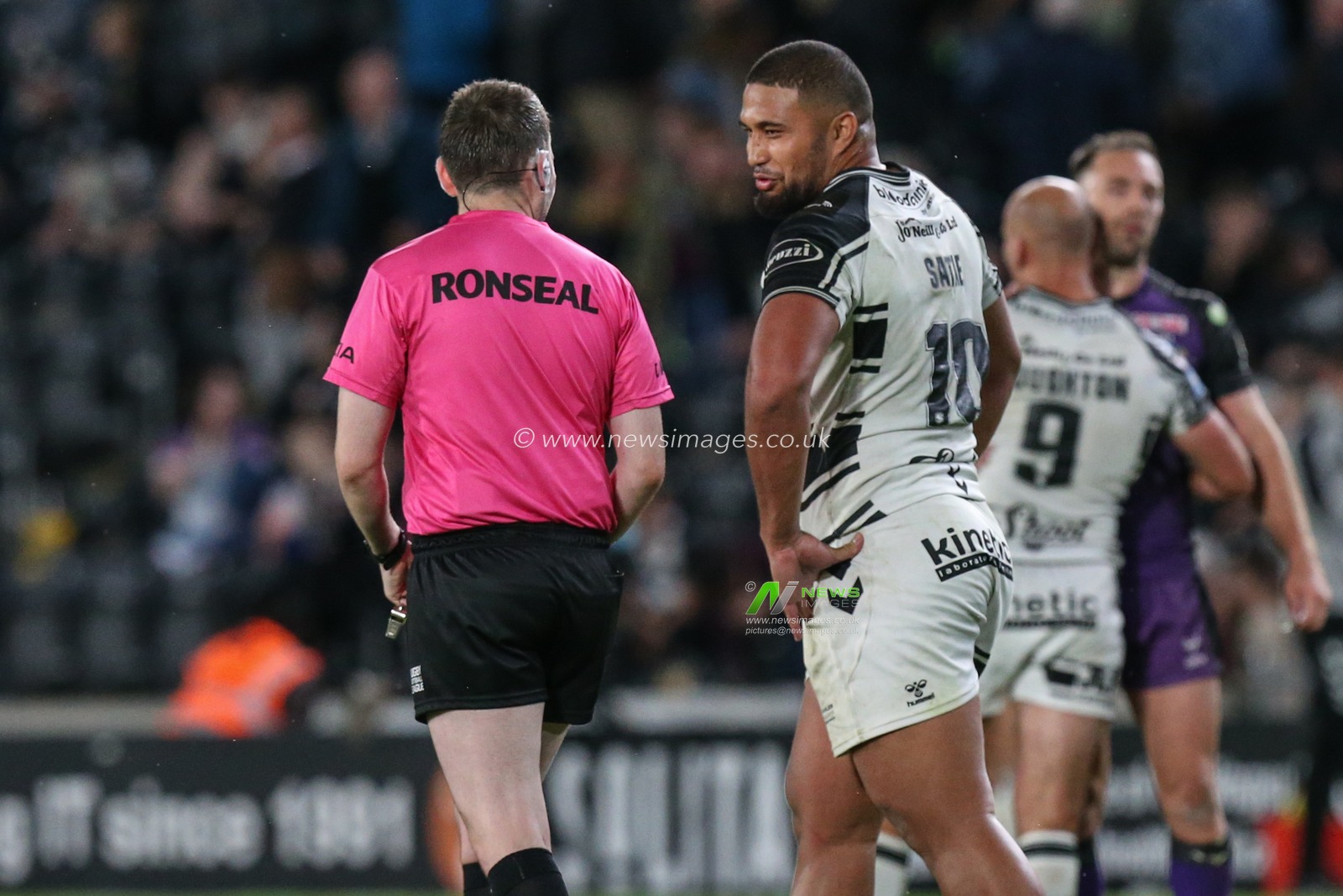 Chris Satae (10) of Hull FC shares a joke with referee Liam Moore