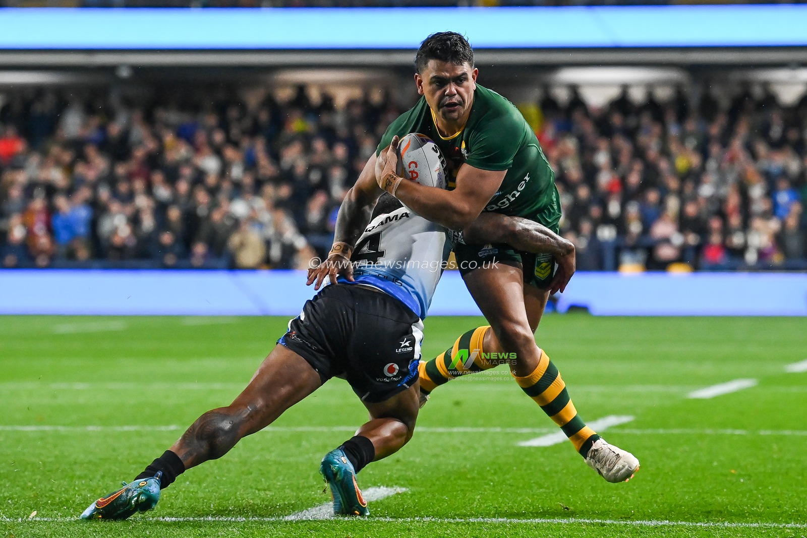 Latrell Mitchell of Australia is tackled by Kevin Naiqama of Fiji during the Rugby League World Cup 2021 match Australia vs Fiji at Headingley Stadium, Leeds, United Kingdom, 15th October 2022

(Photo by Craig Thomas/News Images)