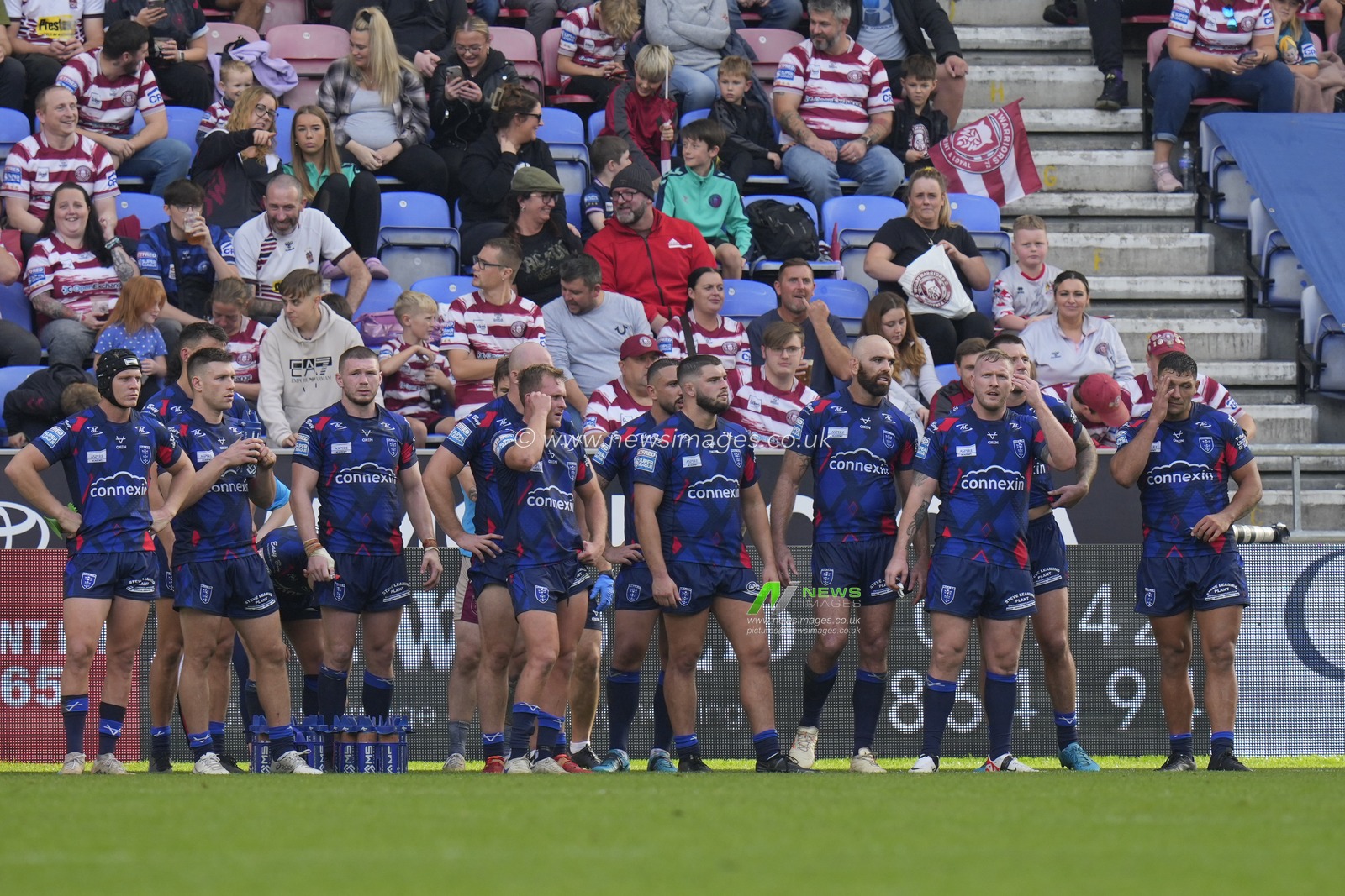 Dejected Hull KR players wait behind the try line for a conversion attempt after a Wigan Warriors try during the Betfred Super League Semi Final match Wigan Warriors vs Hull KR at DW Stadium, Wigan, United Kingdom, 7th October 2023

(Photo by Steve Flynn/News Images)