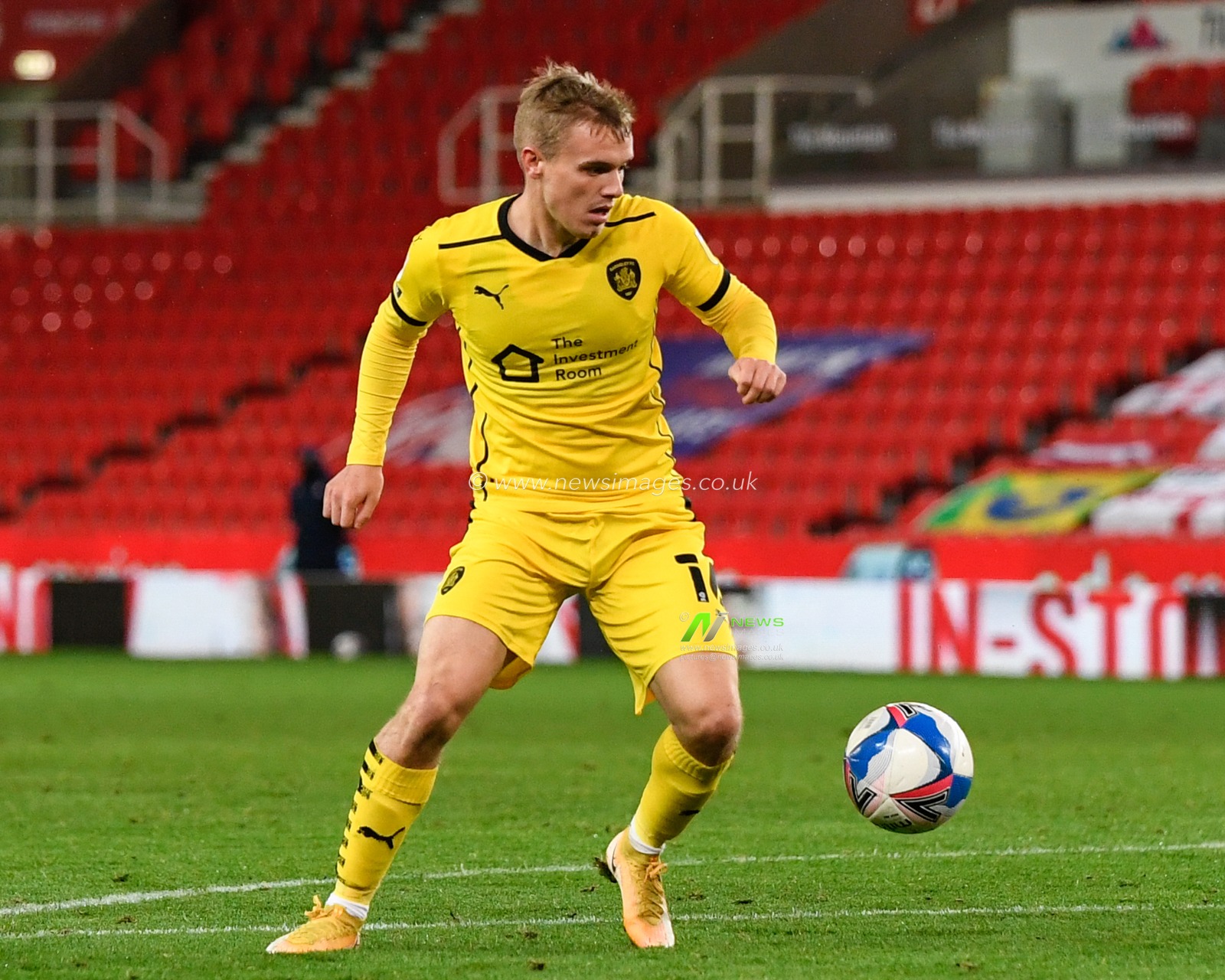 Luke Thomas (16) of Barnsley looks to control the ball