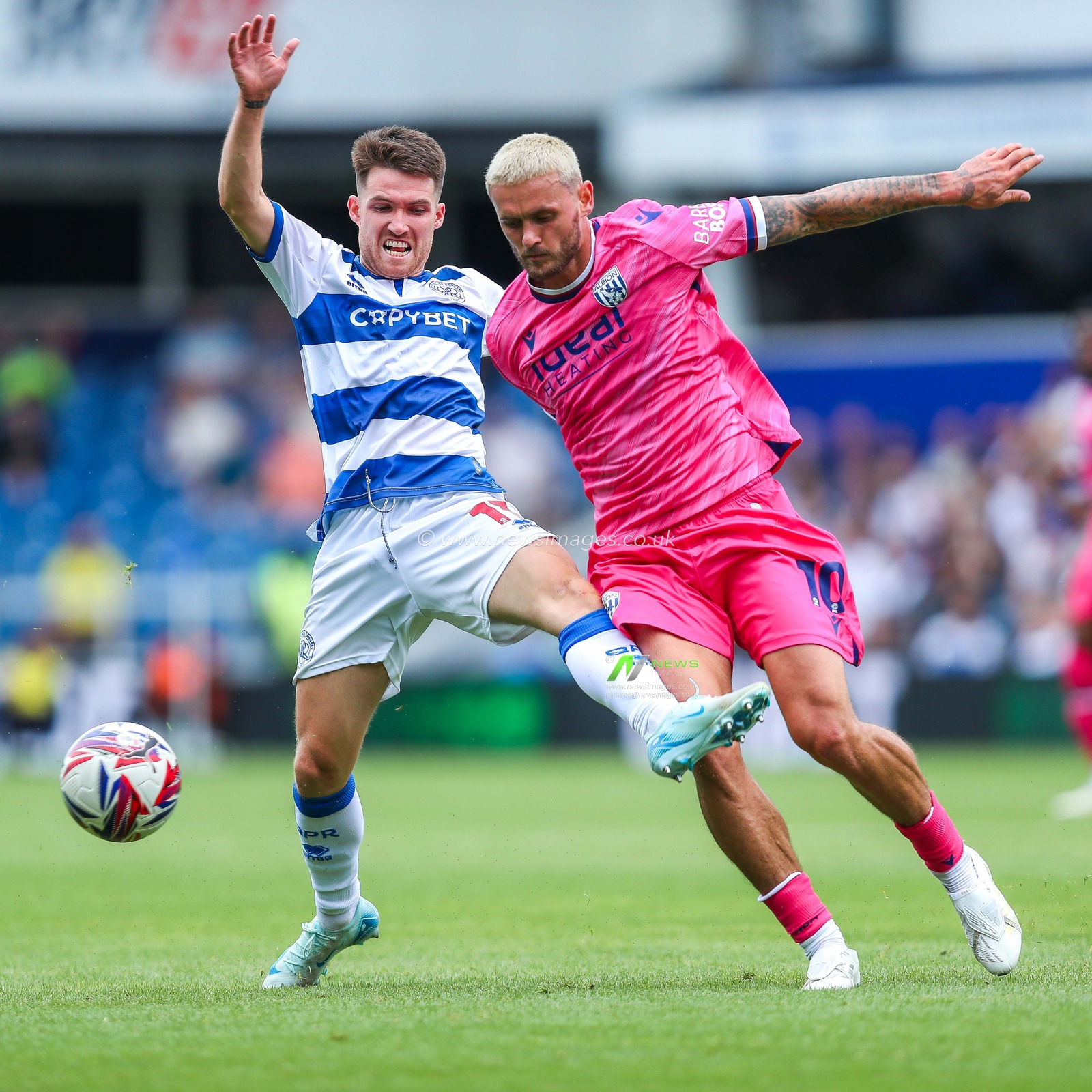 Paul Smyth of Queens Park Rangers battles for the ball with John Swift of West Bromwich Albion during the Sky Bet Championship match Queens Park Rangers vs West Bromwich Albion at Kiyan Prince Foundation Stadium, London, United Kingdom, 10th August 2024

(Photo by Izzy Poles/News Images)