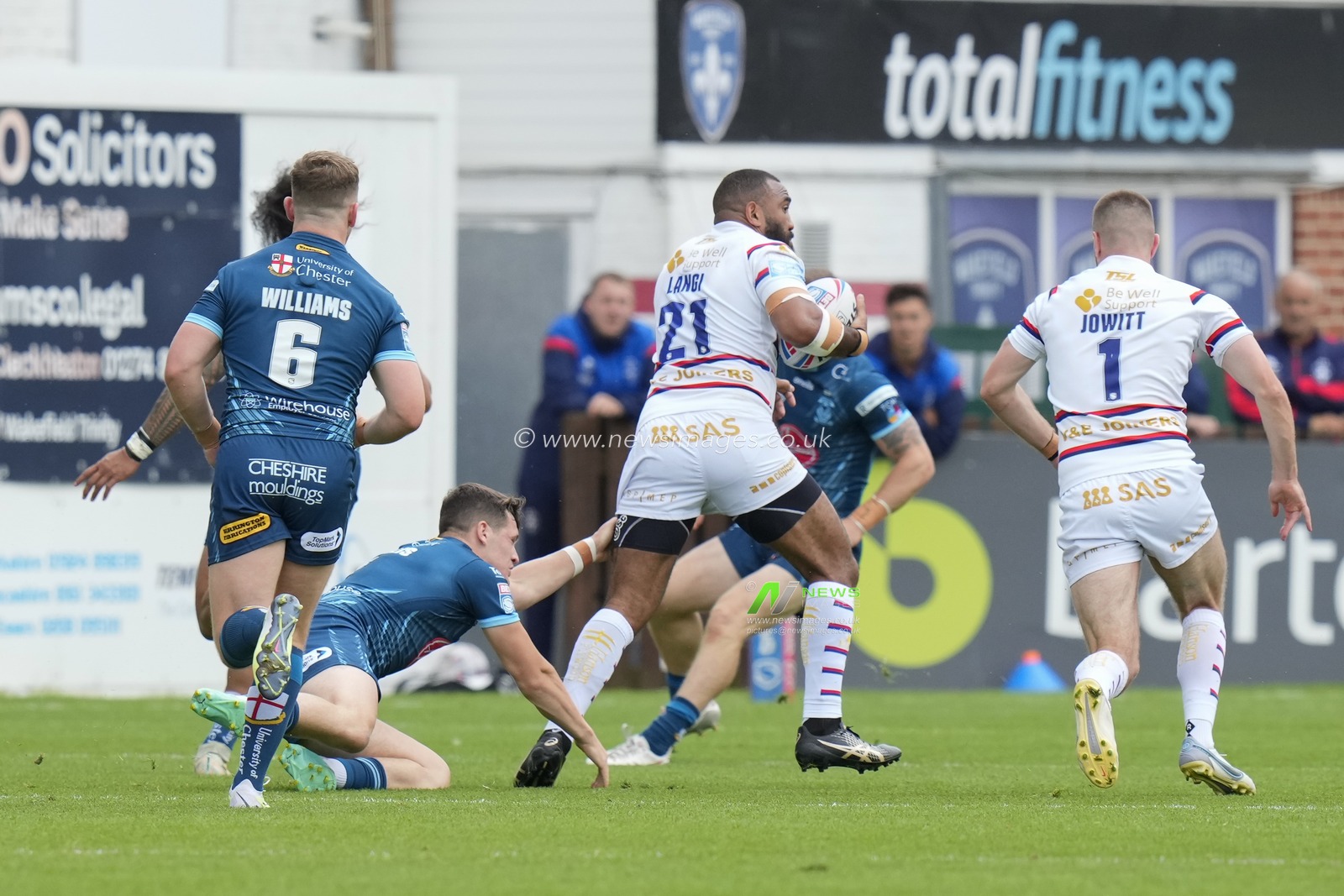 Samisoni Lange #21 of Wakefield Trinity breaks the tackle by Josh Thewlis #2 of Warrington Wolves during the Betfred Super League Round 20 match Wakefield Trinity vs Warrington Wolves at The Be Well Support Stadium, Wakefield, United Kingdom, 30th July 2023

(Photo by Steve Flynn/News Images)