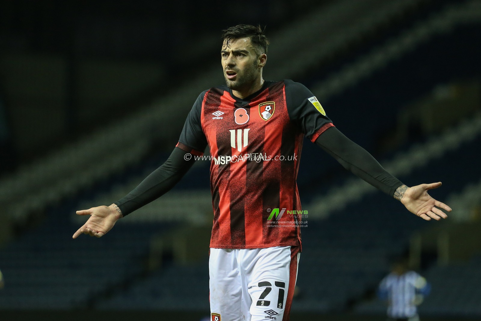 Diego Rico (21) of Bournemouth is seen unhappy with the linemanâ€™s decision