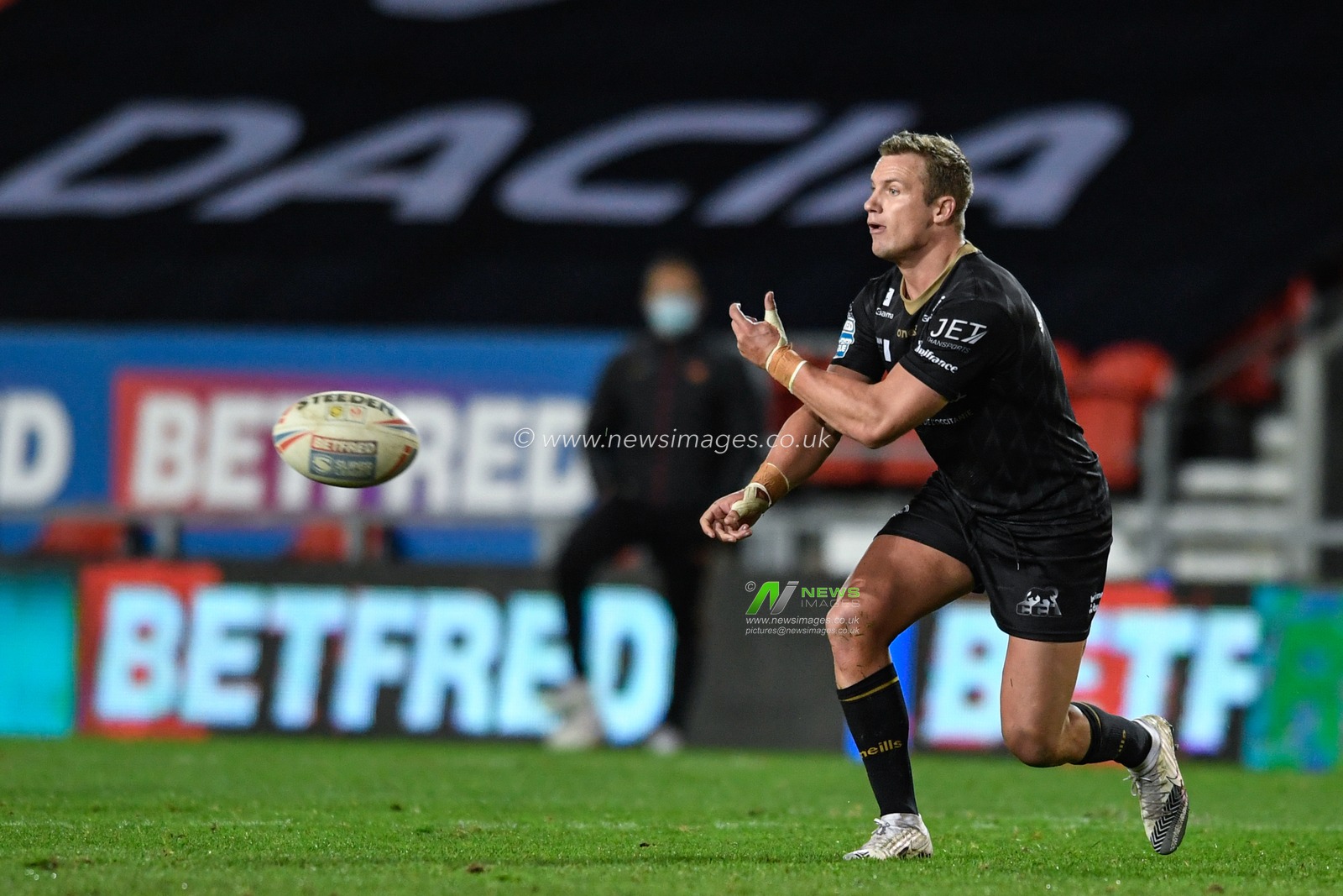 Josh Drinkwater #7 of Catalans Dragons passes the ball