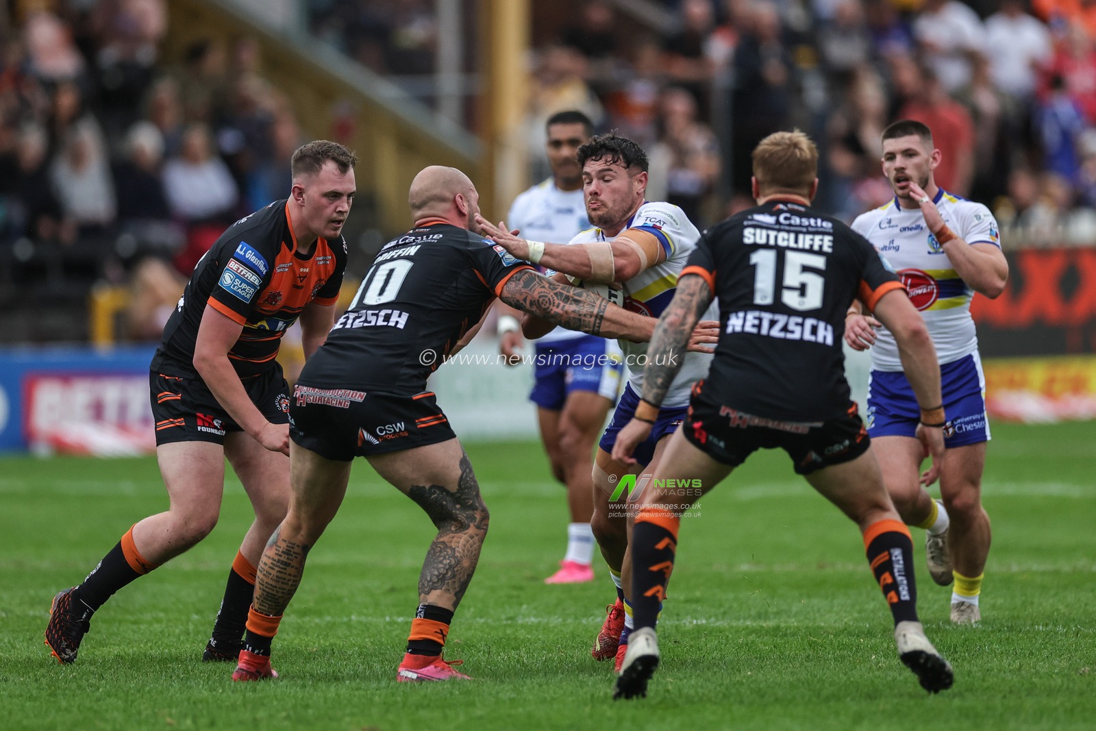 Joe Philbin #15 of Warrington Wolves is tackled by George Griffin #10 of Castleford Tigers during the Betfred Super League Round 16 match Castleford Tigers vs Warrington Wolves at The Mend-A-Hose Jungle, Castleford, United Kingdom, 23rd June 2023

(Photo by Mark Cosgrove/News Images)