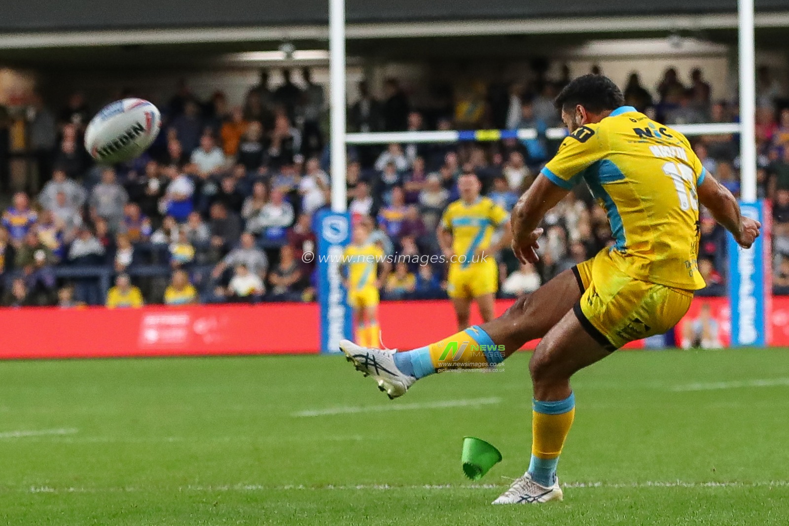 Rhyse Martin #12 of Leeds Rhinos converts a goal kick tomato it 6-0