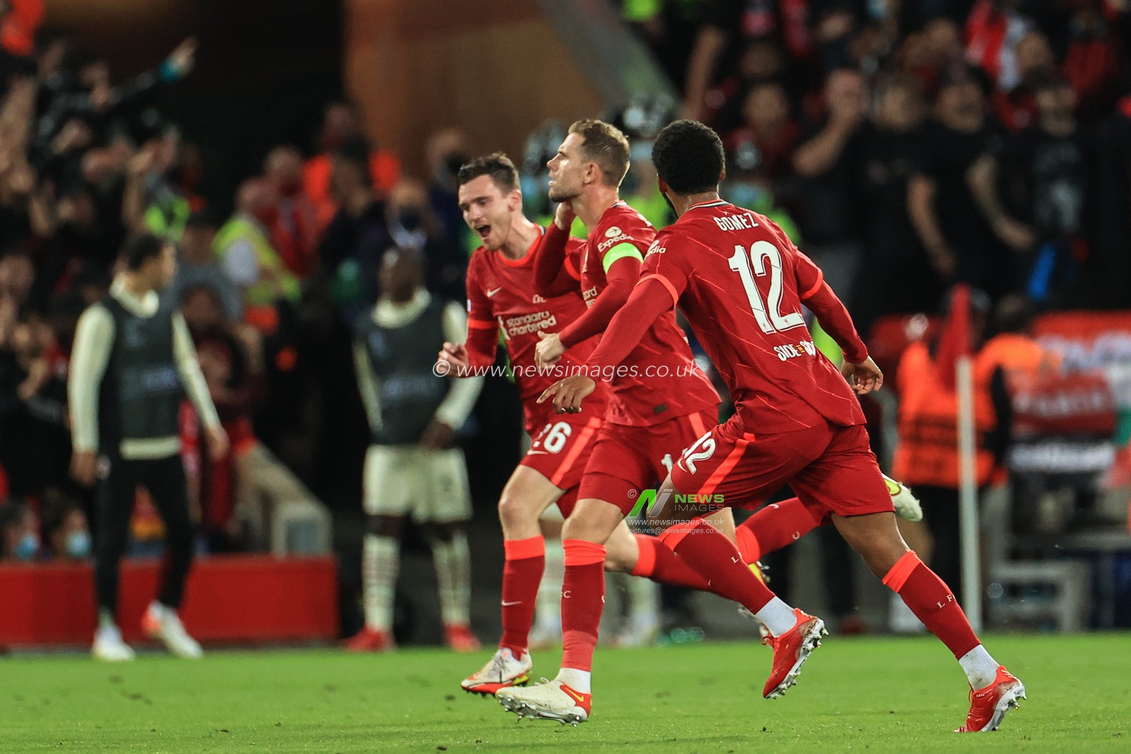 Jordan Henderson #14 of Liverpool celebrates his goal to make it 3-2
