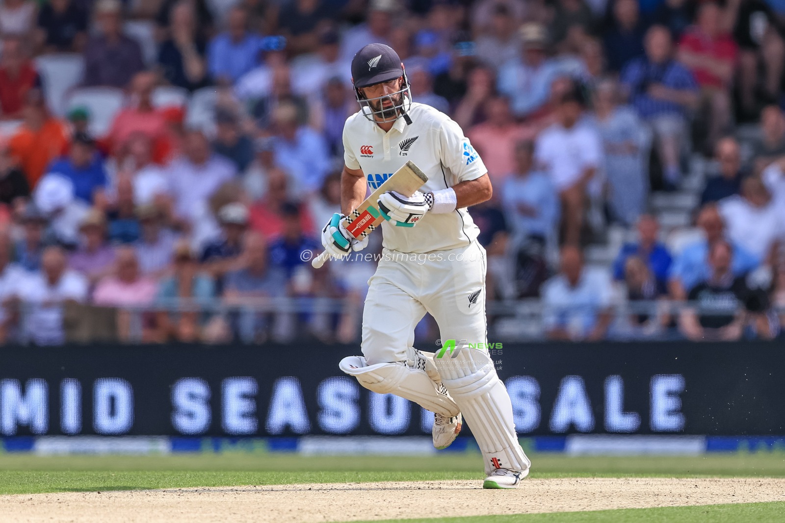 Daryl Mitchell of New Zealand makes one run