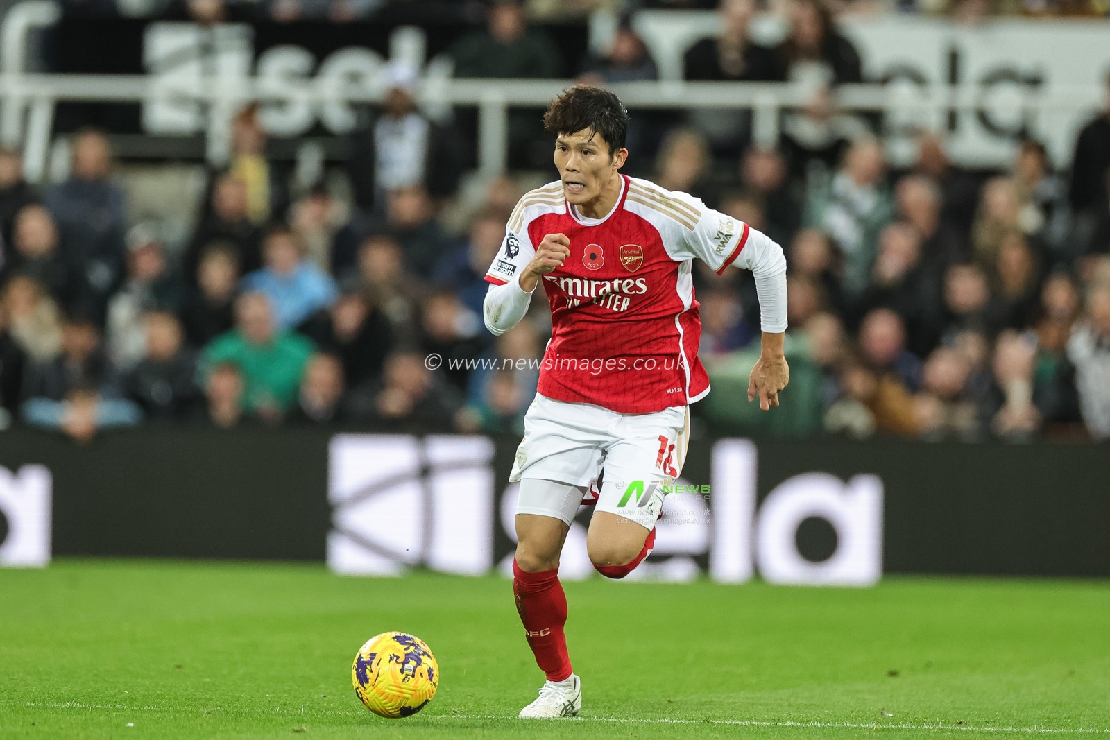 Takehiro Tomiyasu #18 of Arsenal with the ball during the Premier League match Newcastle United vs Arsenal at St. James's Park, Newcastle, United Kingdom, 4th November 2023

(Photo by Mark Cosgrove/News Images)