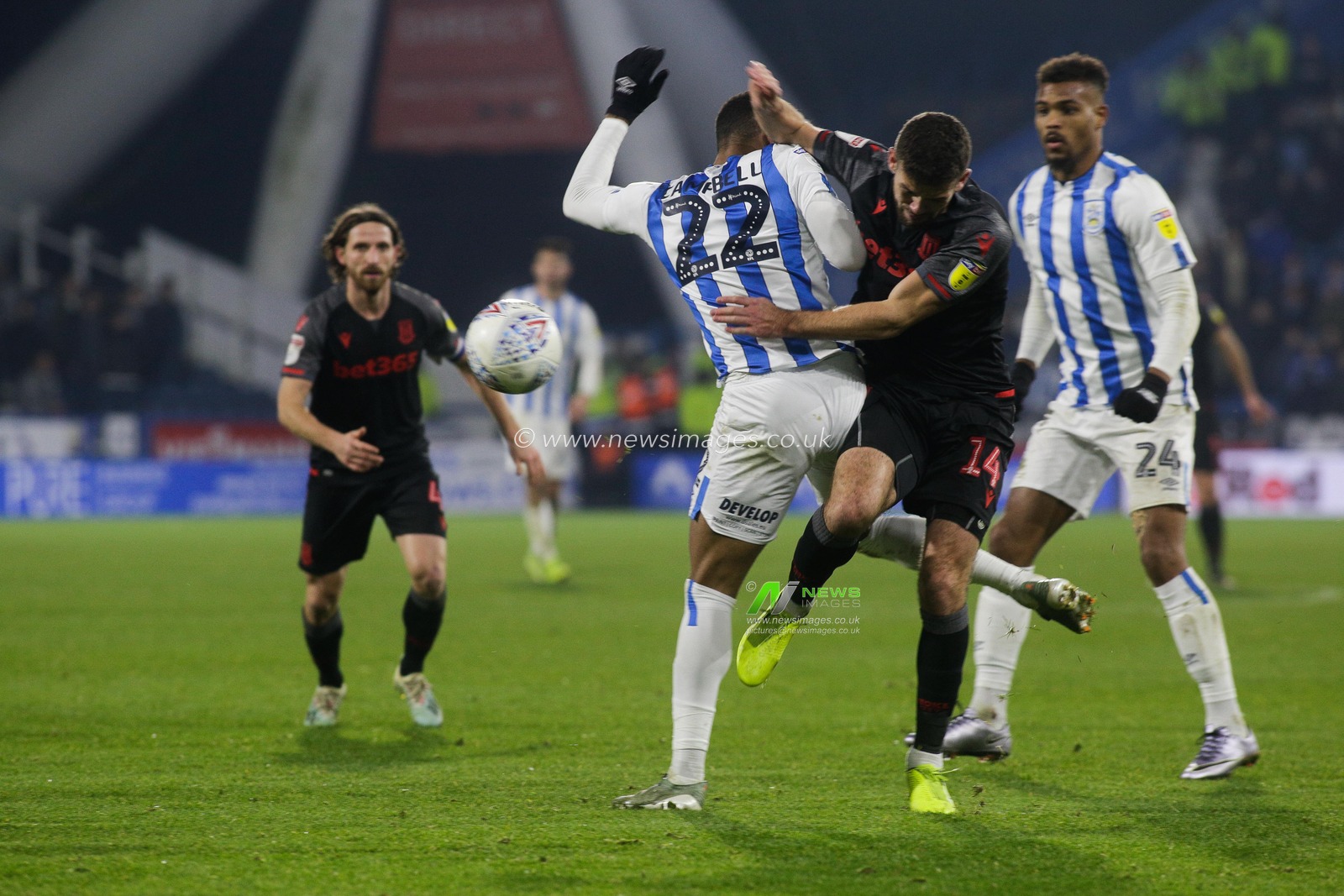 1st January 2020, John Smith's Stadium, Huddersfield, England; Sky Bet Championship, Huddersfield Town v Stoke City : Fraizer Campbell (22) of Huddersfield Town and Tommy Smith (14) of Stoke City collide 

Credit: Kurt Fairhurst/News Images