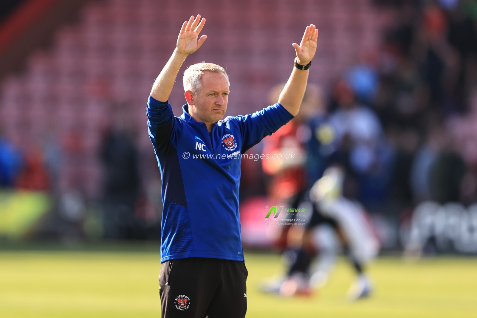 Neil Critchley Head Coach of Blackpool applauds the traveling fans as Blackpool take a 2-2 draw after coming back for being two goals down