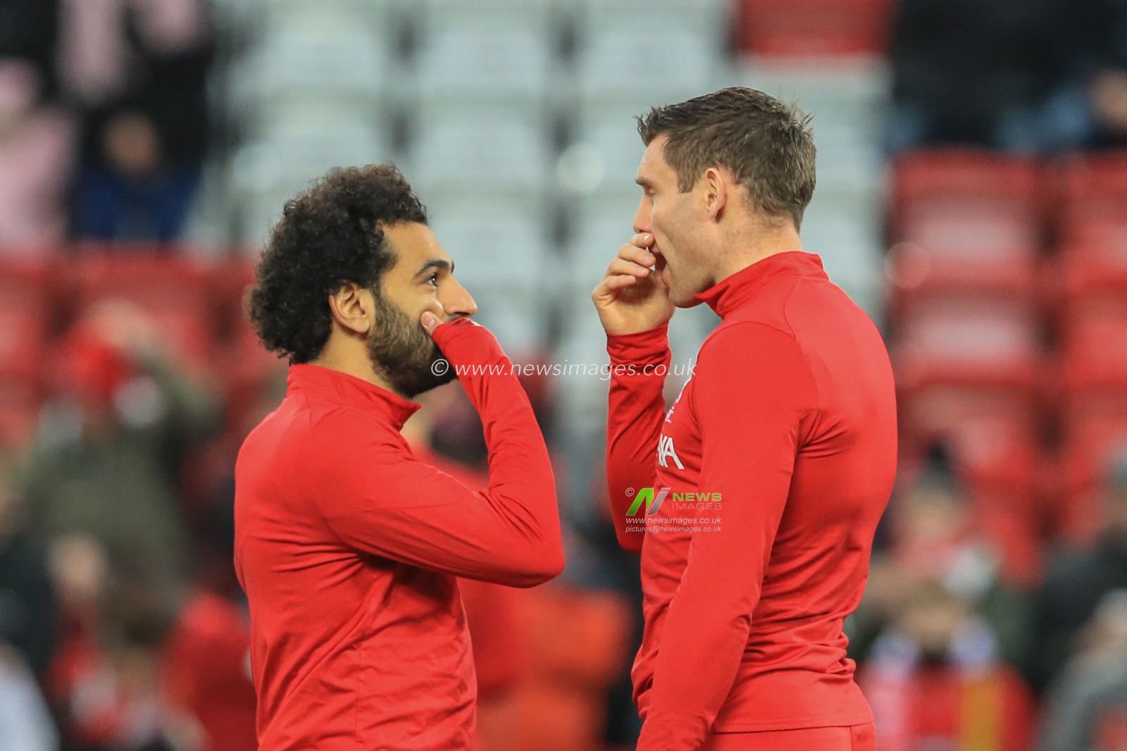 29th December 2019, Anfield, Liverpool, England; Premier League, Liverpool v Wolverhampton Wanderers : James Milner (7) of Liverpool and Mohamed Salah (11) of Liverpool talks during warm-up 

Credit: Mark Cosgrove/News Images