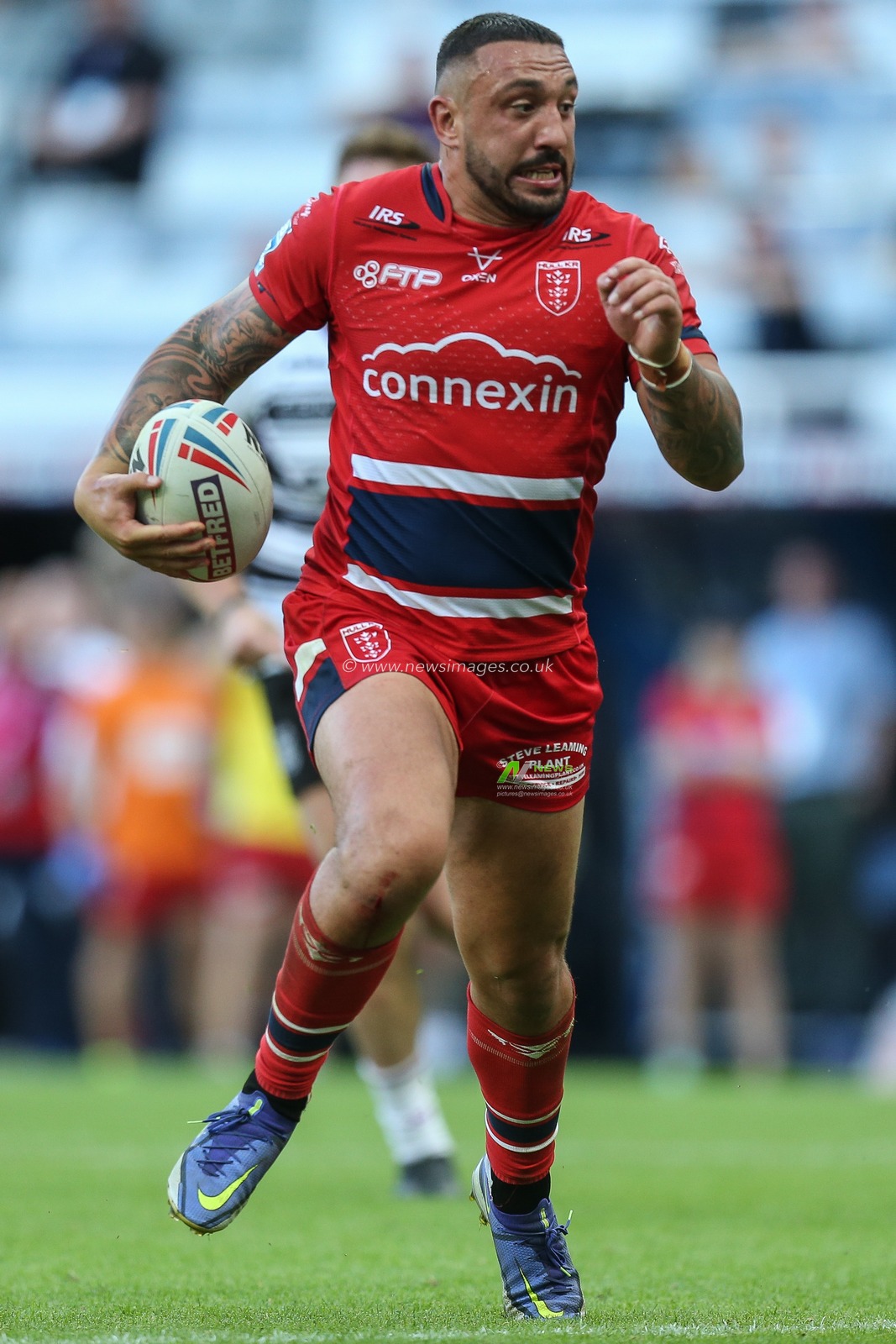 Elliot Minchella #17 of Hull KR runs with the ball up the pitch