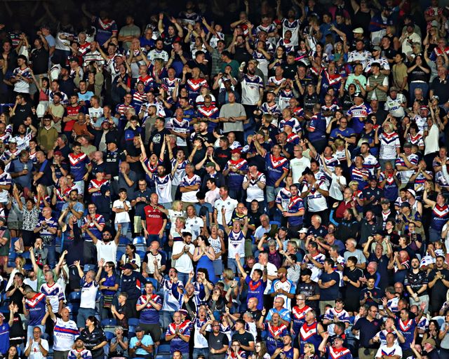 Wakefield fans celebrate during the Betfred Super League round 19 match Huddersfield Giants vs Wakefield Trinity at the Accu Stadium, Huddersfield, United Kingdom, 18th July 2025

(Photo by Sam Eaden/News Images)