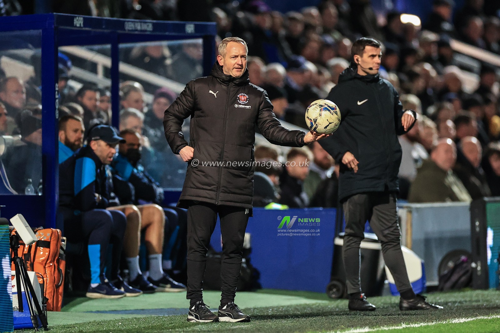 Neil Critchley head coach of Blackpool hands the ball back into play