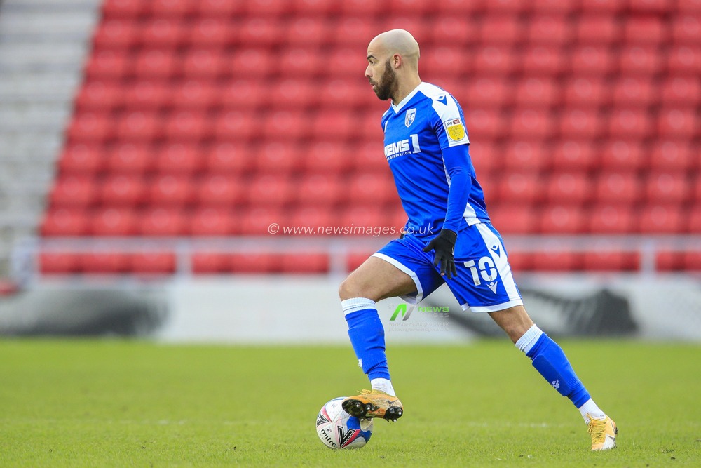 Jordan Graham #10 of Gillingham in possession of the ball