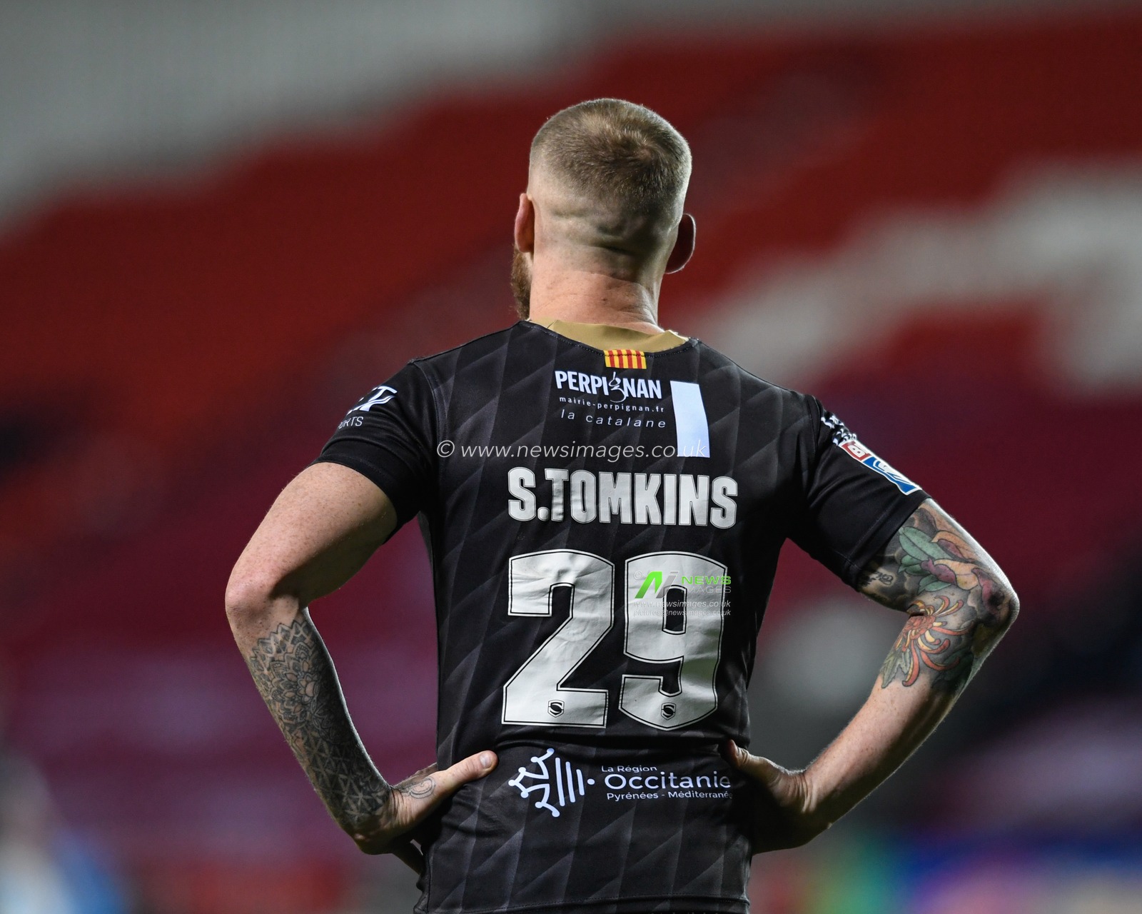 Sam Tomkins #29 of Catalans Dragons stands with his hands on his hips