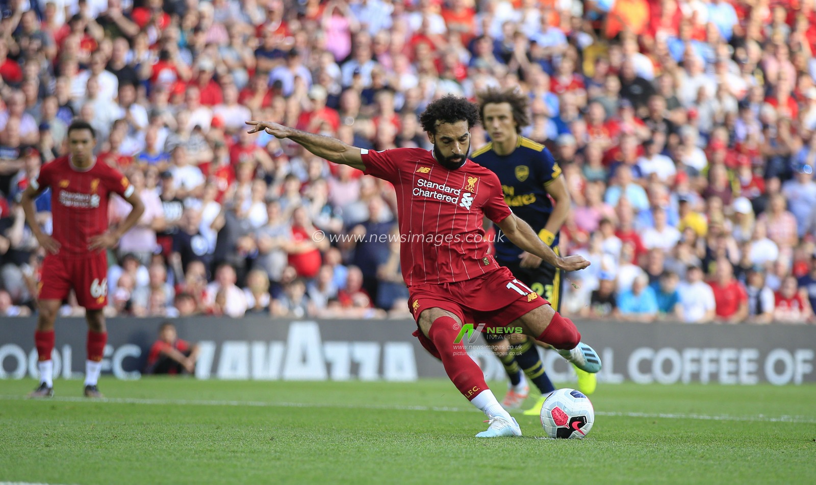 23rd August 2019 , Anfield, Liverpool, England; Premier League Football, Liverpool vs Arsenal ;   Mohamed Salah (11) of Liverpool scores from the penalty spot in the 49th minute, 2-0 to Liverpool

Credit: Conor Molloy/News Images 


Premier League/EFL Football images are subject to DataCo Licence