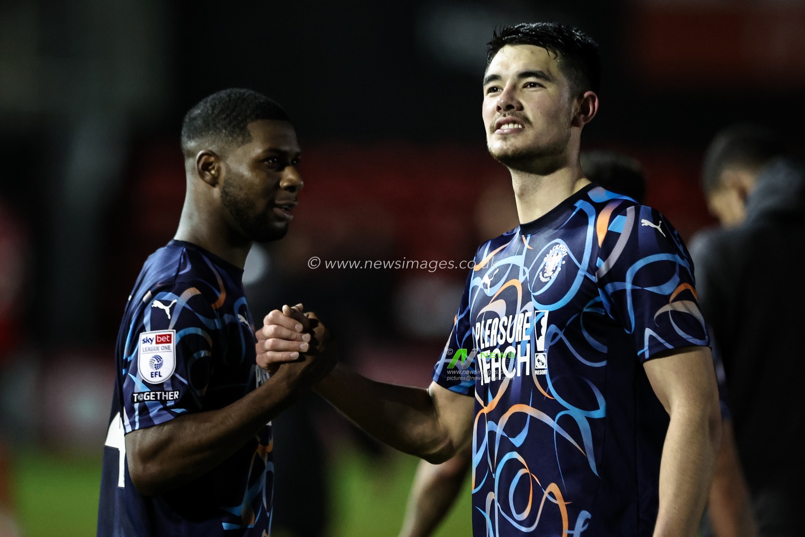 Joshua Onomah of Blackpool shakes hands with Elkan Baggott of Blackpool after winning 0-2 during the Sky Bet League 1 match Lincoln City vs Blackpool at Gelder Group Sincil Bank Stadium, Lincoln, United Kingdom, 28th January 2025

(Photo by Mark Cosgrove/News Images)