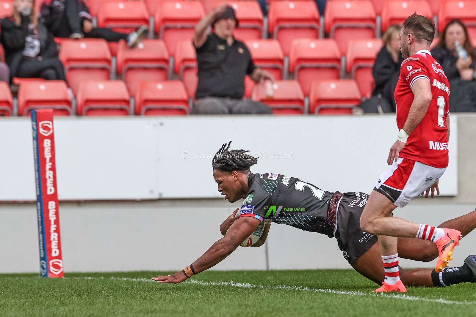 Junior Nsemba of Wigan Warriors goes over for a try during the Betfred Super League Round 12 match Salford Red Devils vs Wigan Warriors at Salford Community Stadium, Eccles, United Kingdom, 26th May 2024

(Photo by Mark Cosgrove/News Images)
