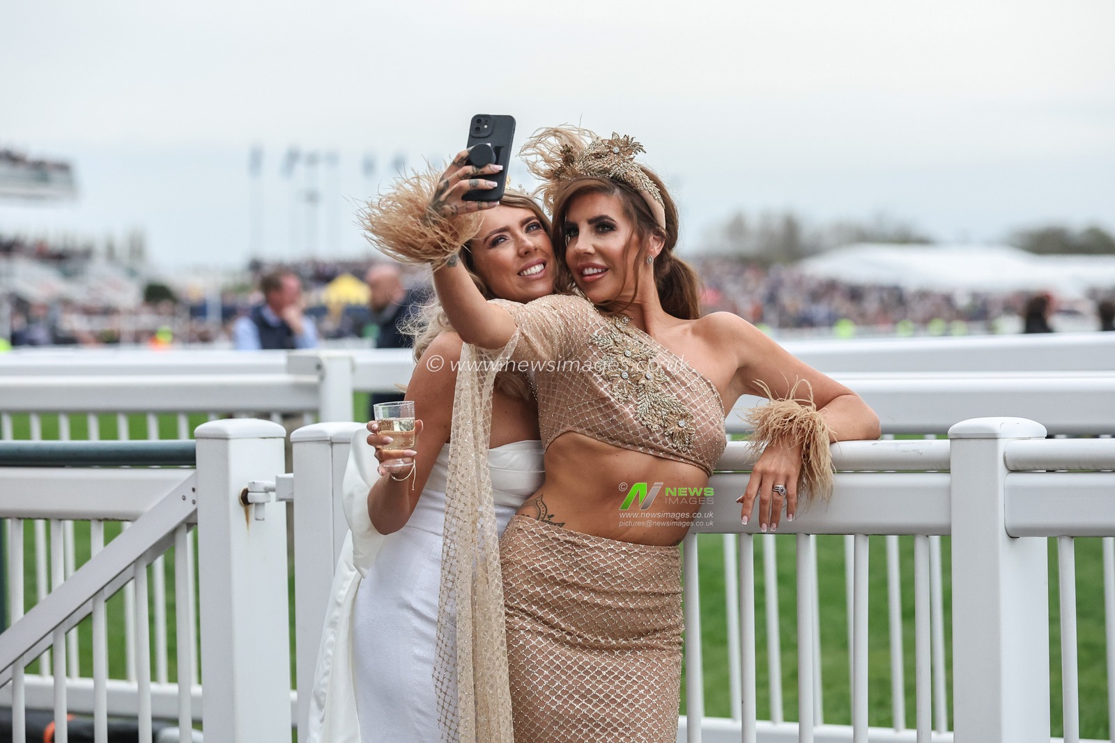 Racegoers enjoy the atmosphere during the The Randox Grand National 2024 Ladies Day at Aintree Racecourse, Liverpool, United Kingdom, 12th April 2024

(Photo by Mark Cosgrove/News Images)